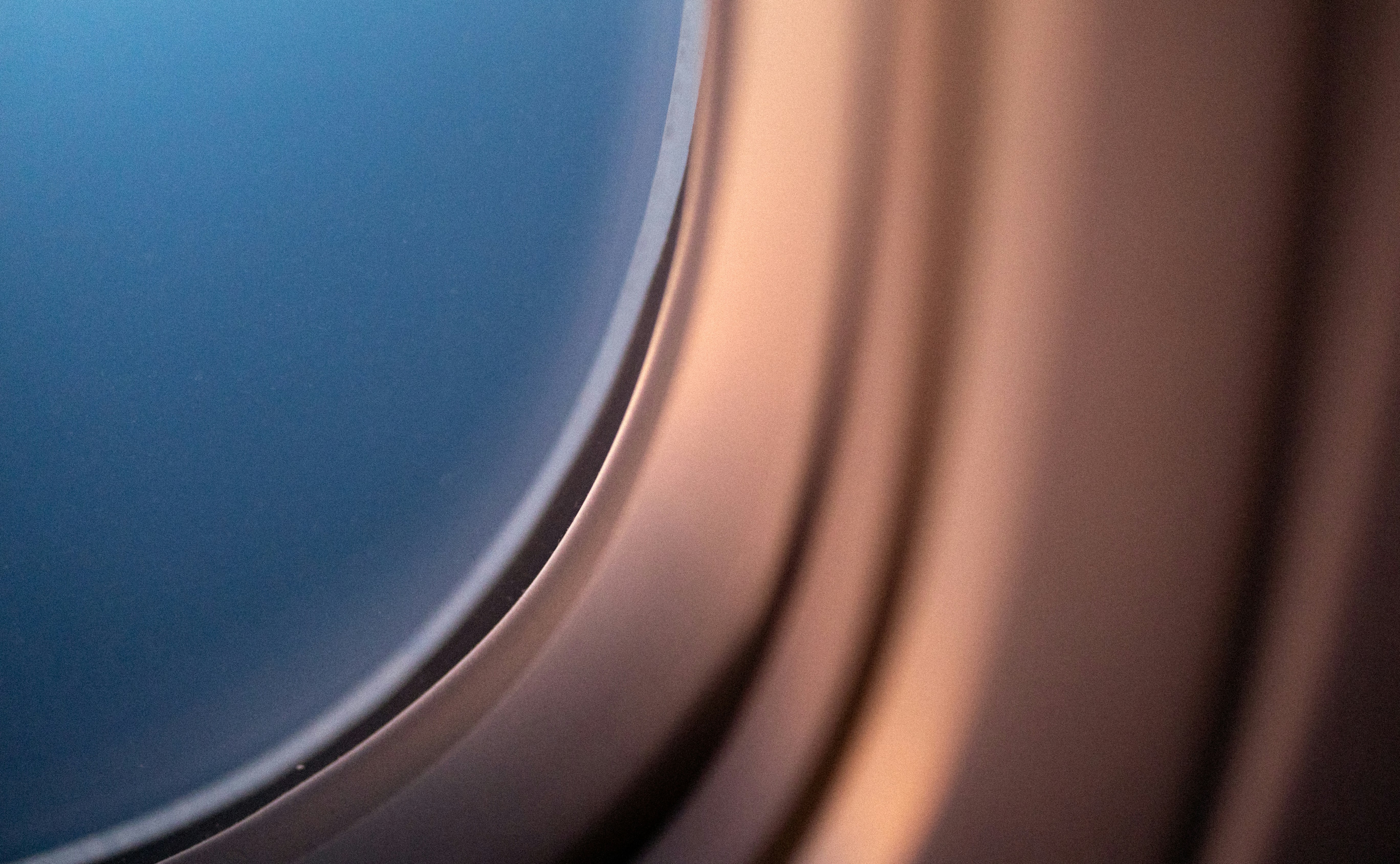 Close-up view of an airplane window at sunset