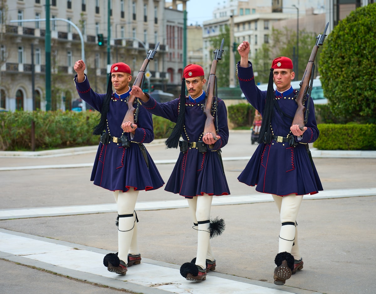 Syntagma Athens — Evzone guards in ceremonial uniform marching at the Tomb of the Unknown Soldier, Syntagma Square