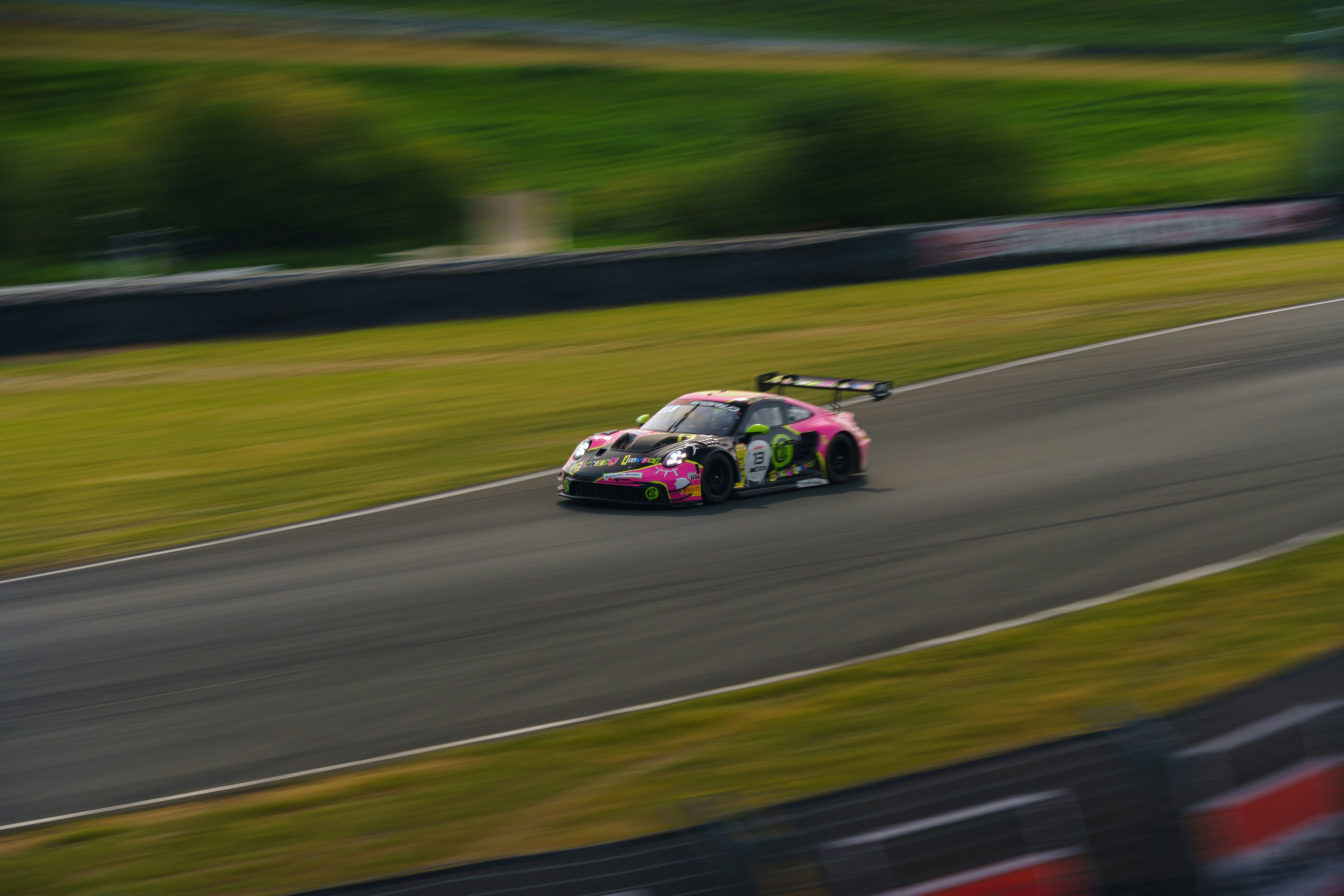 Race car speeding around a track with motion blur photo – Free Sports ...