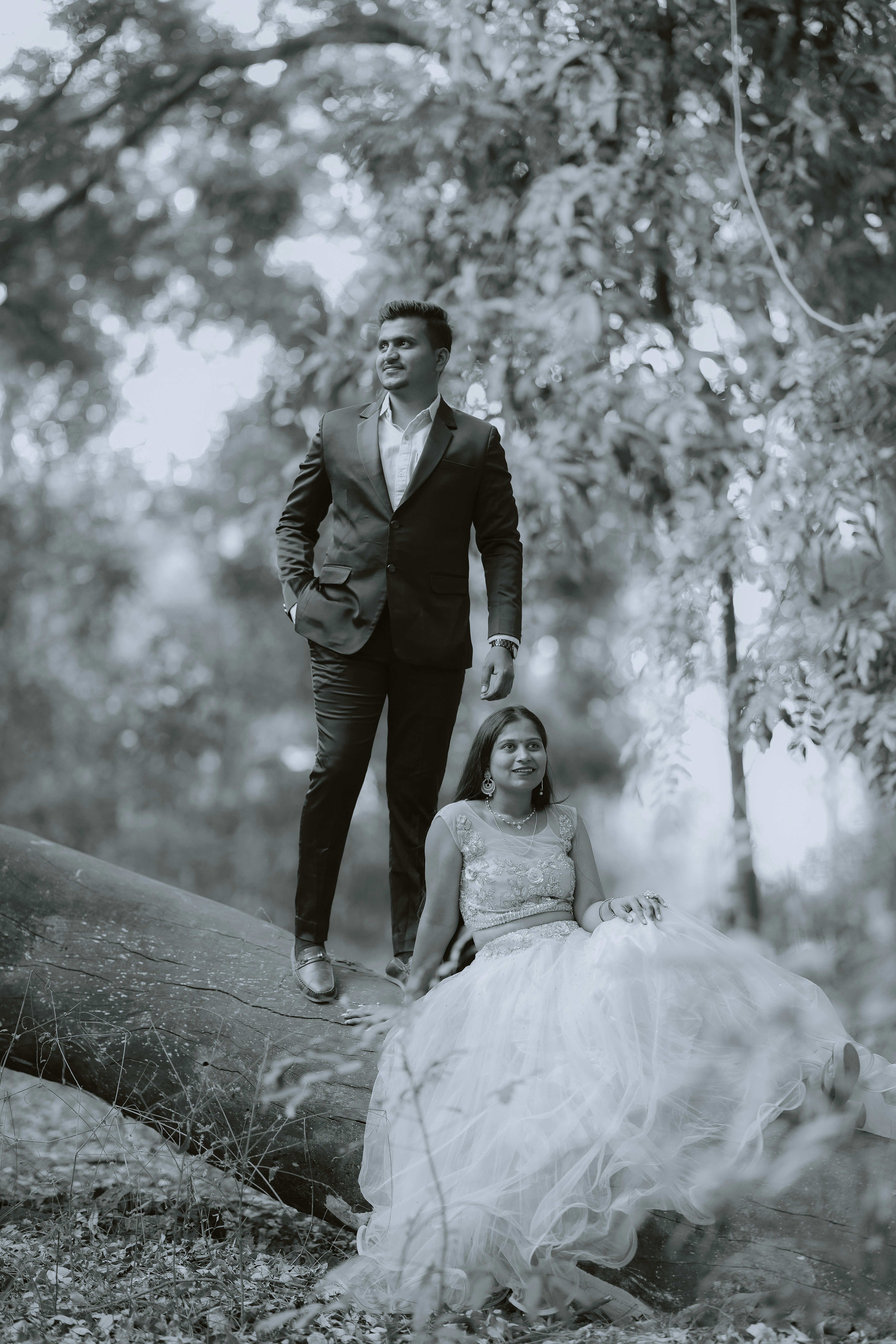 Couple posing in a forest setting
