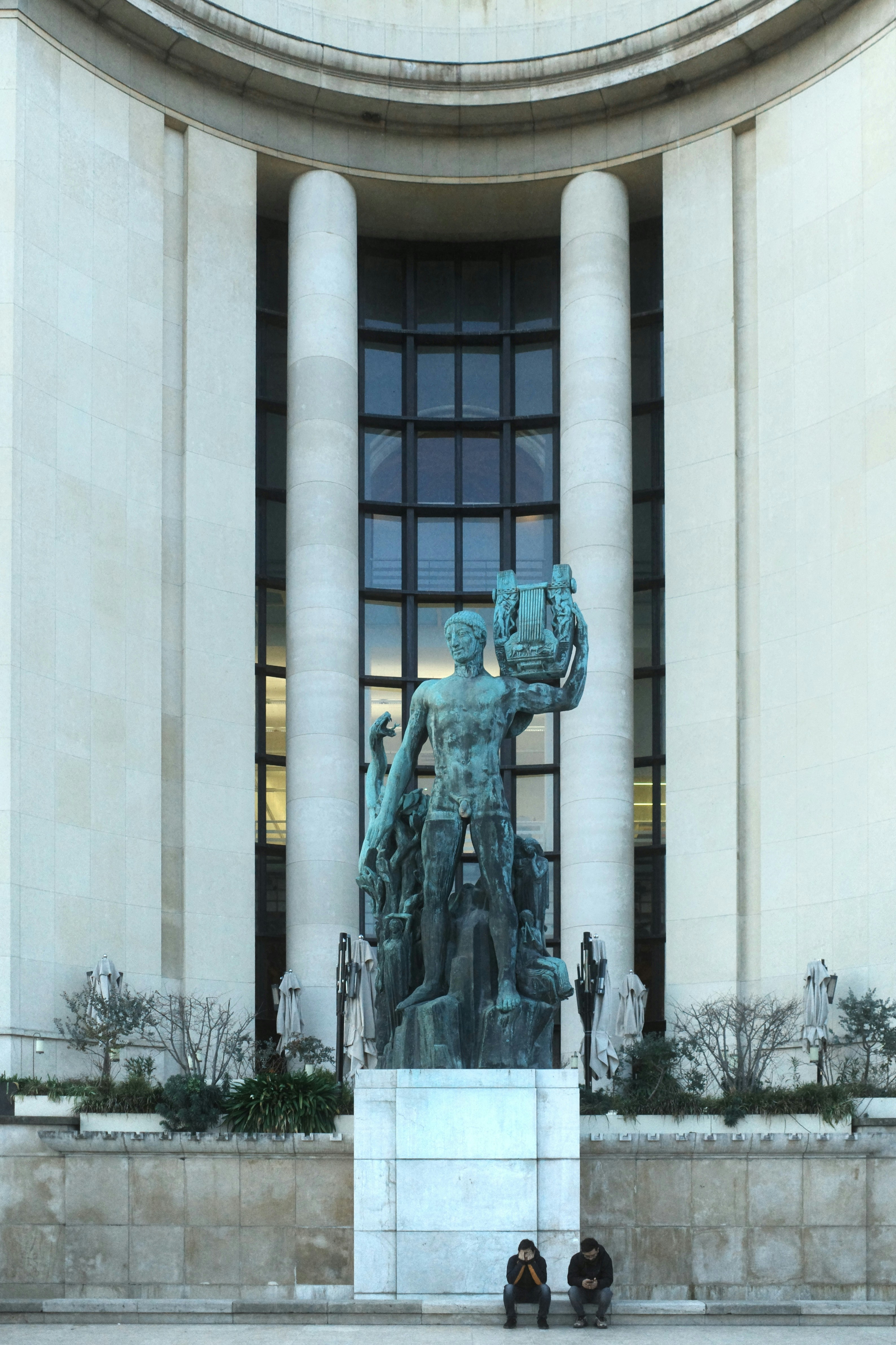 Bronze sculpture in front of a grand building
