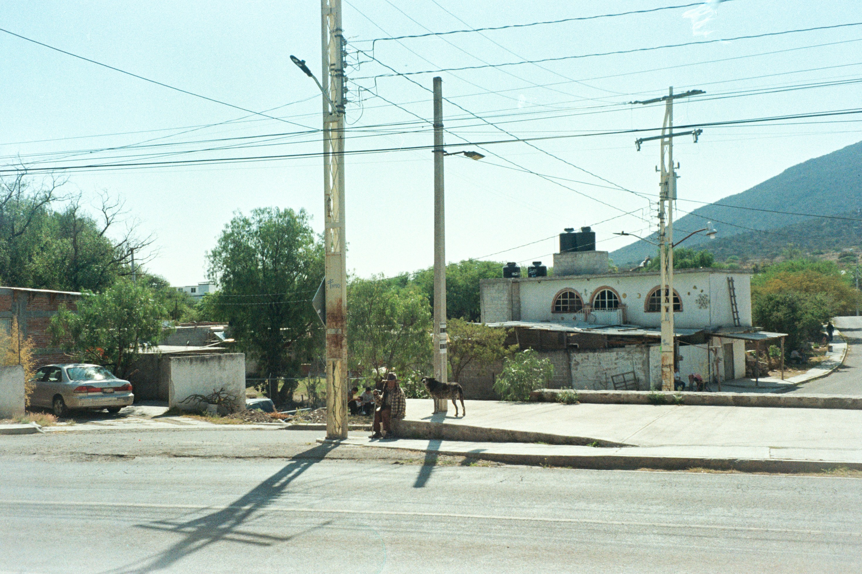 A street scene with buildings and power lines.