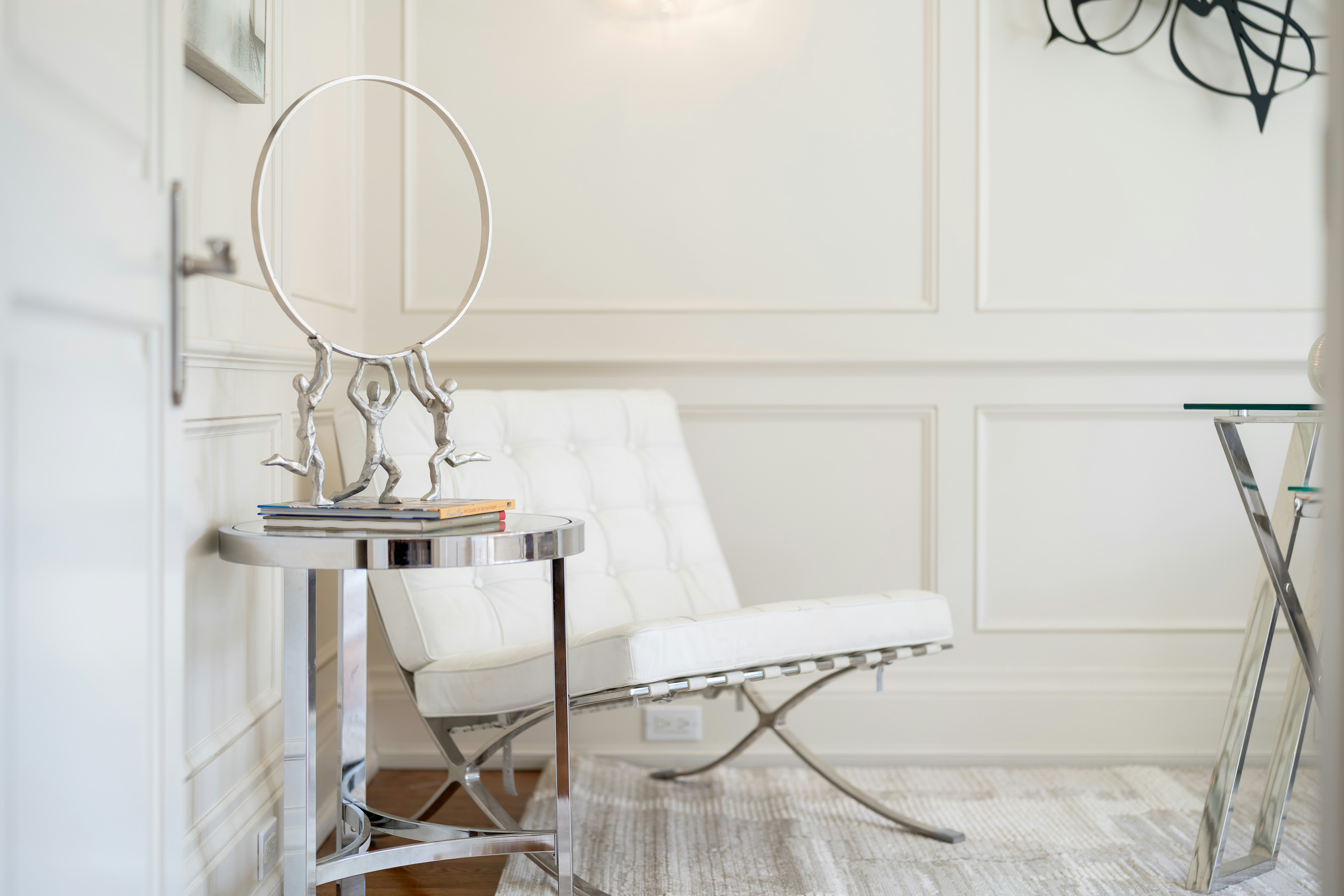 Modern white chair and silver vanity mirror