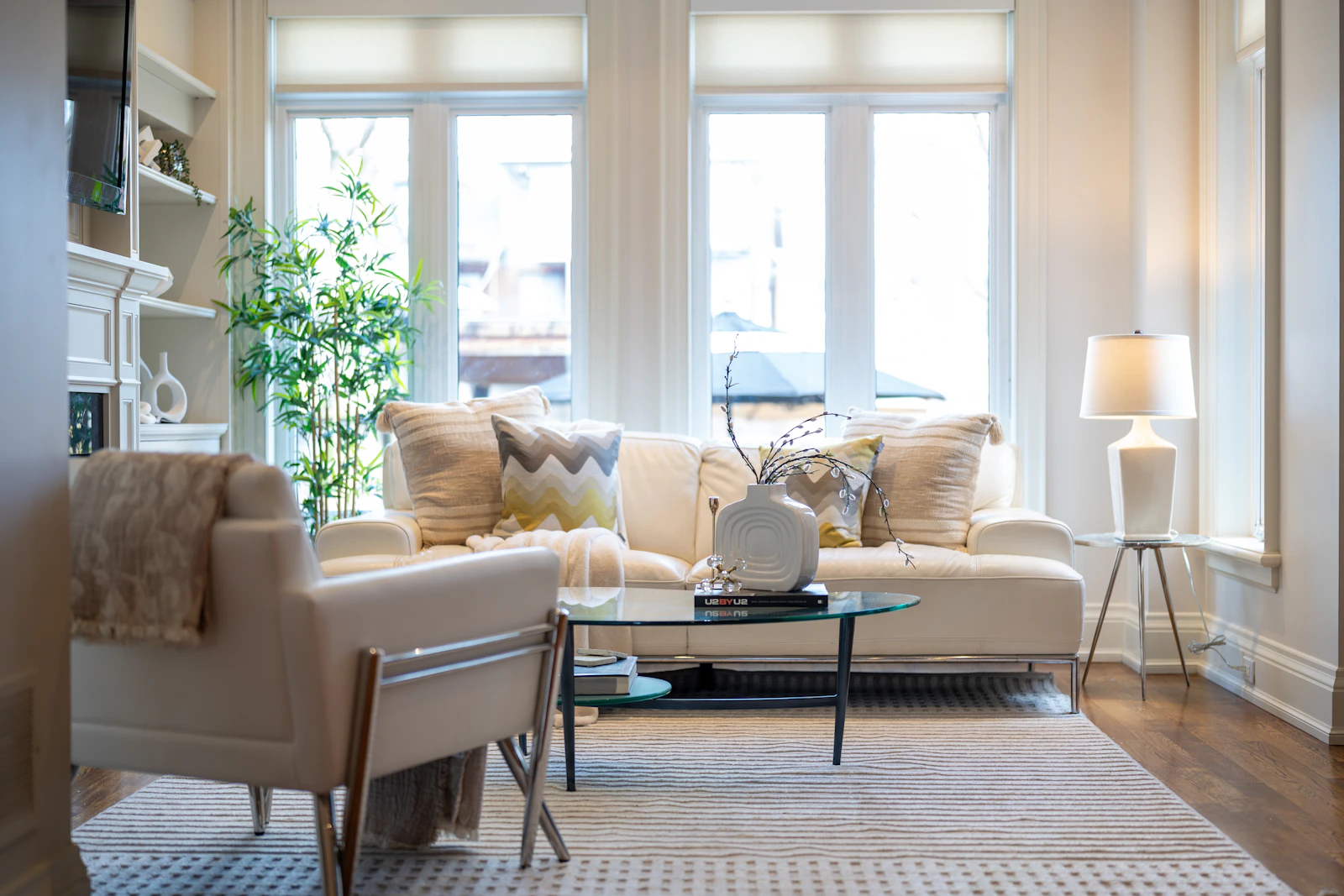 Elegant living room with a sofa, accent chair, coffee table, and refined home furnishings