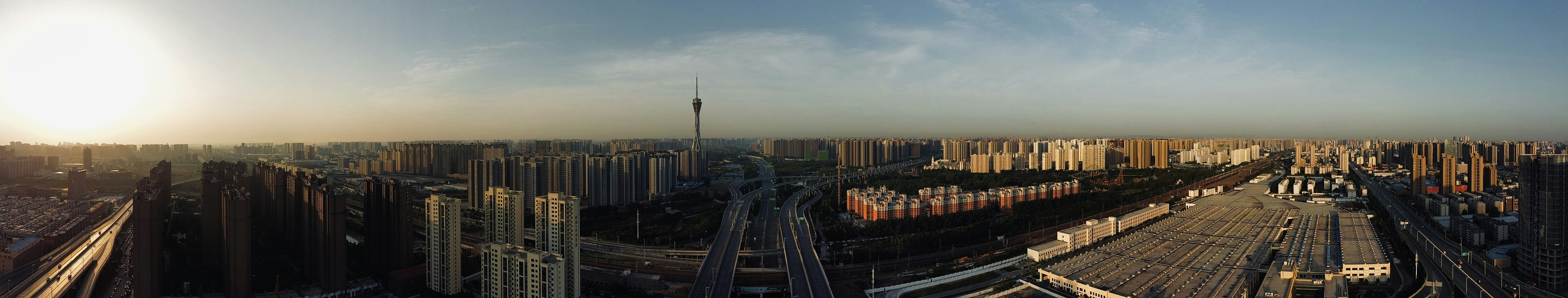 Panoramic View of a City Skyline at Sunset