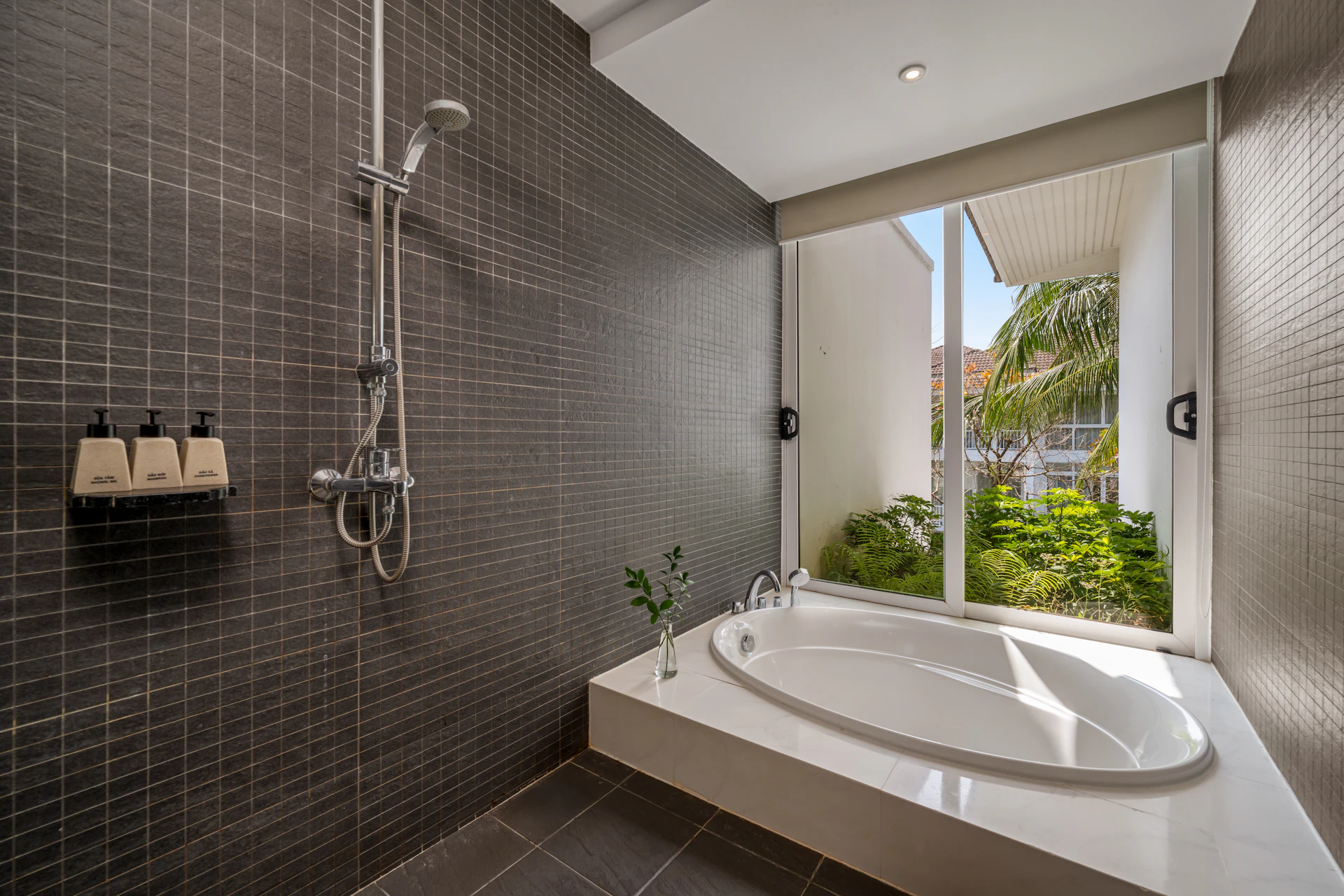 Modern bathroom with bathtub, shower enclosure, and luxury fittings
