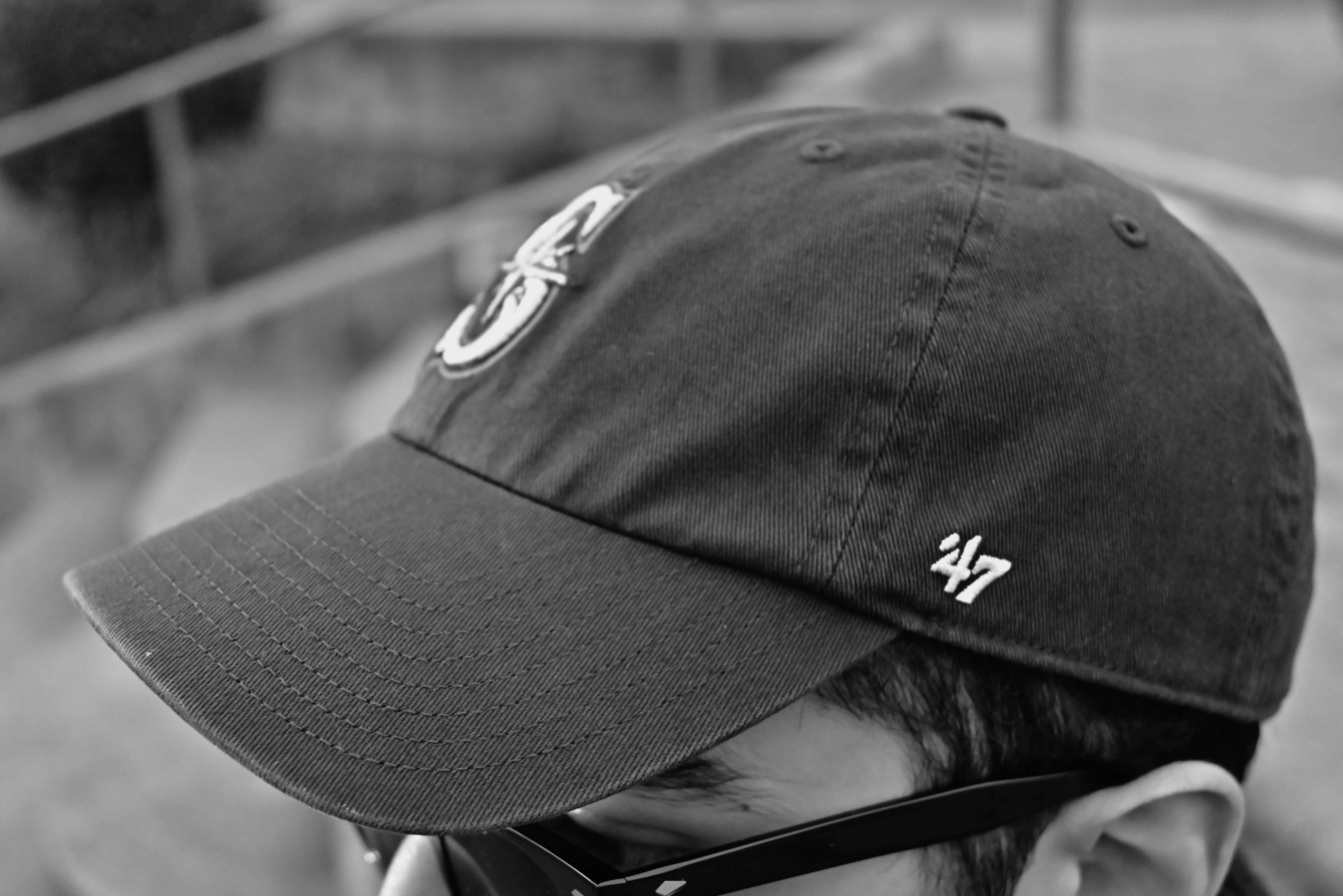 Close-up of a person wearing a baseball cap