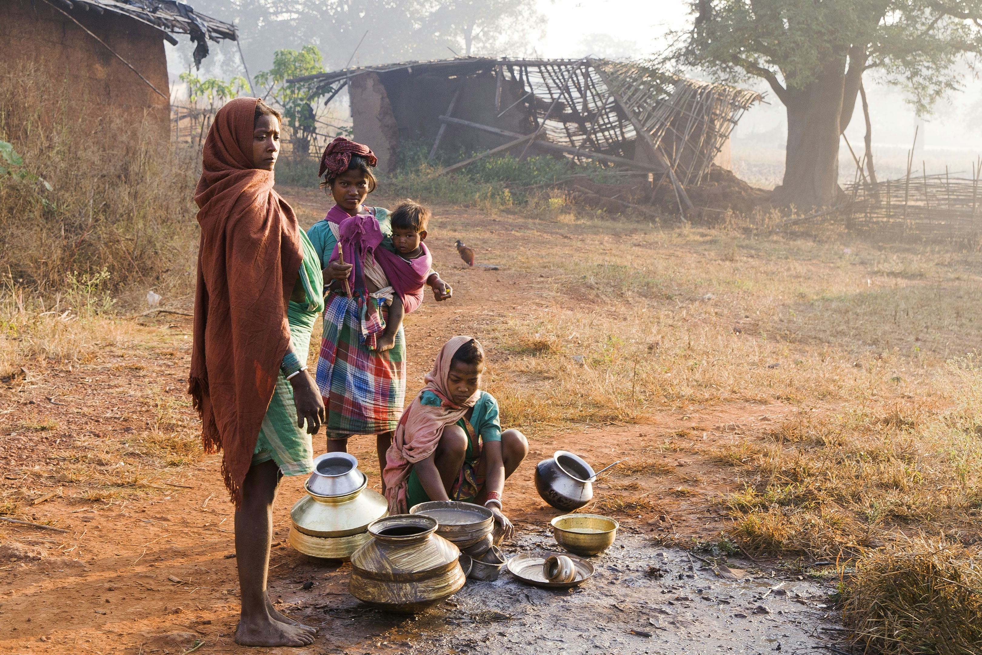 Villagers gather water from a communal source.