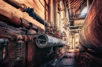Industrial interior with pipes and machinery