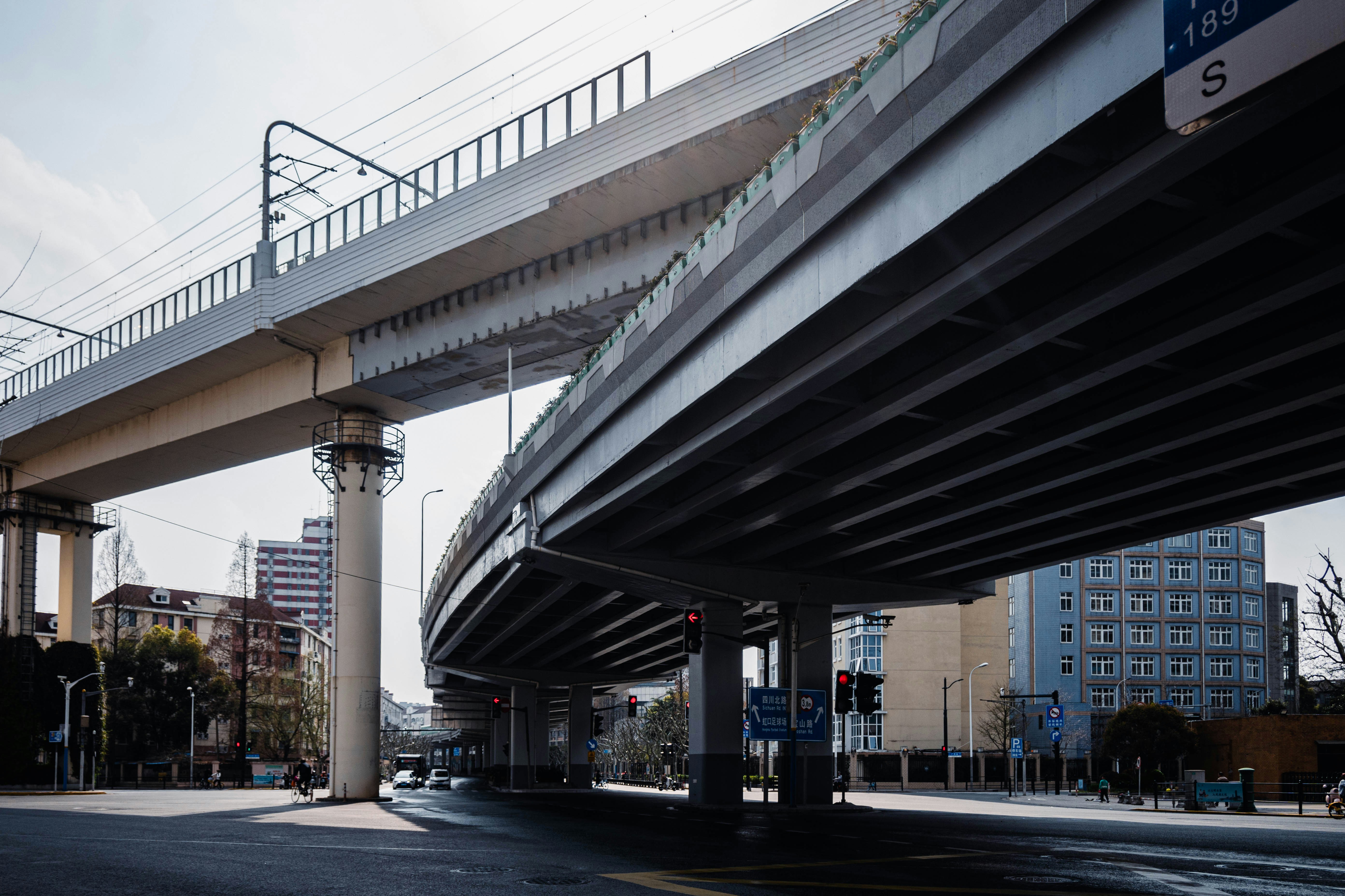 Elevated highway overpass with train tracks above
