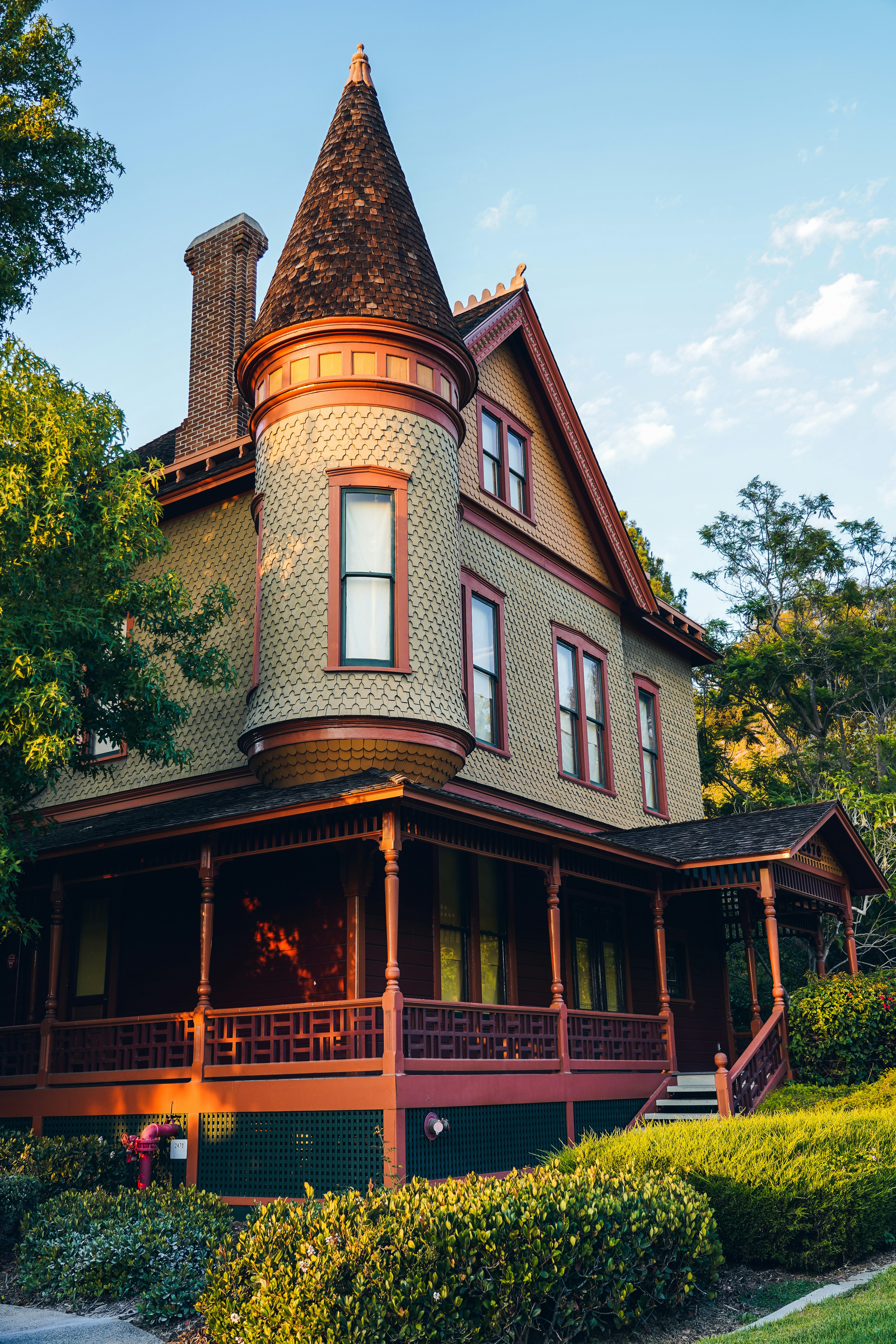 Victorian house with a conical turret and wrap-around porch