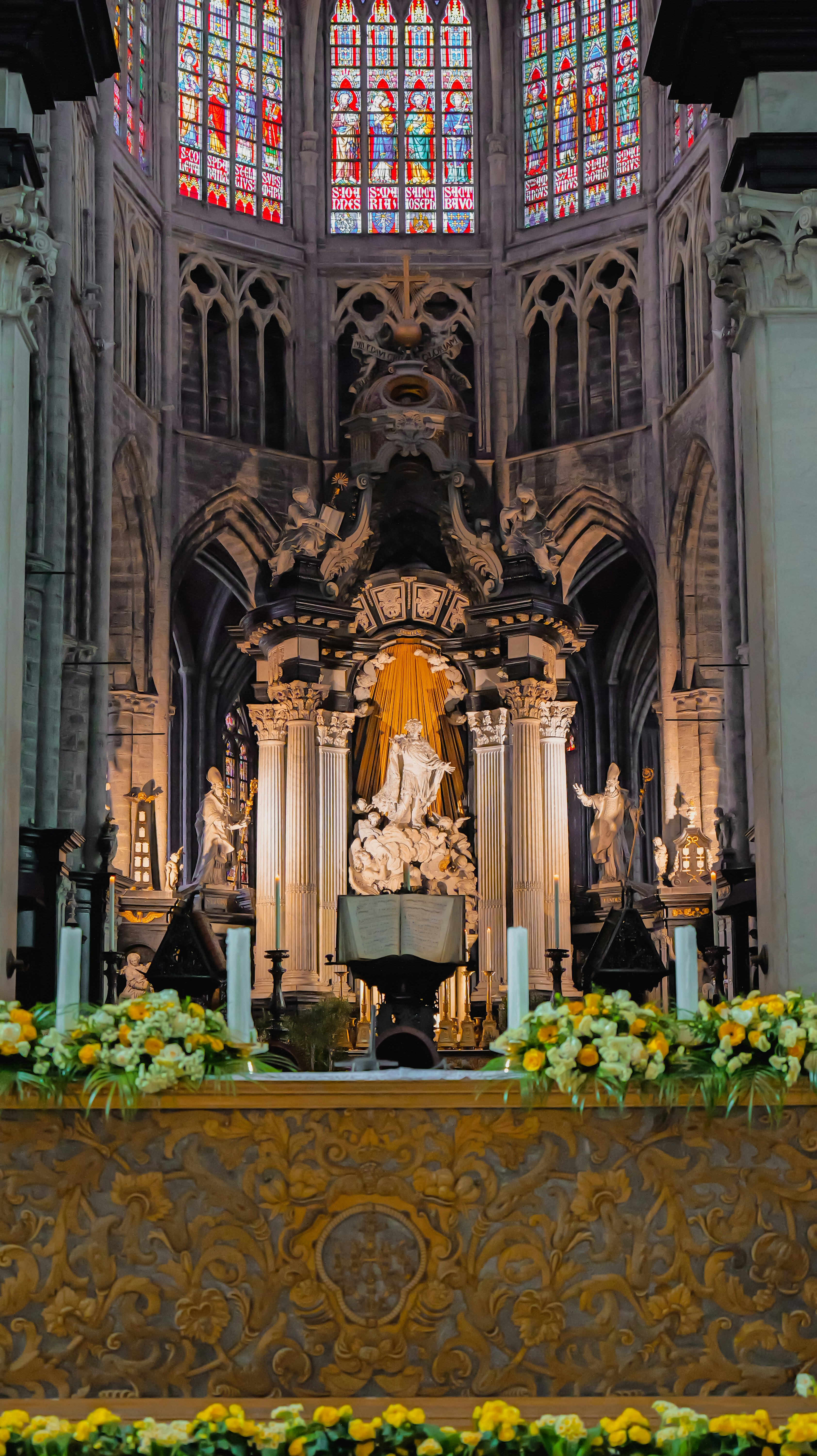 Ornate altar with stained glass windows in church - ornate-altar-with-stained-glass-windows-in-church-tkxyu0ymCgw