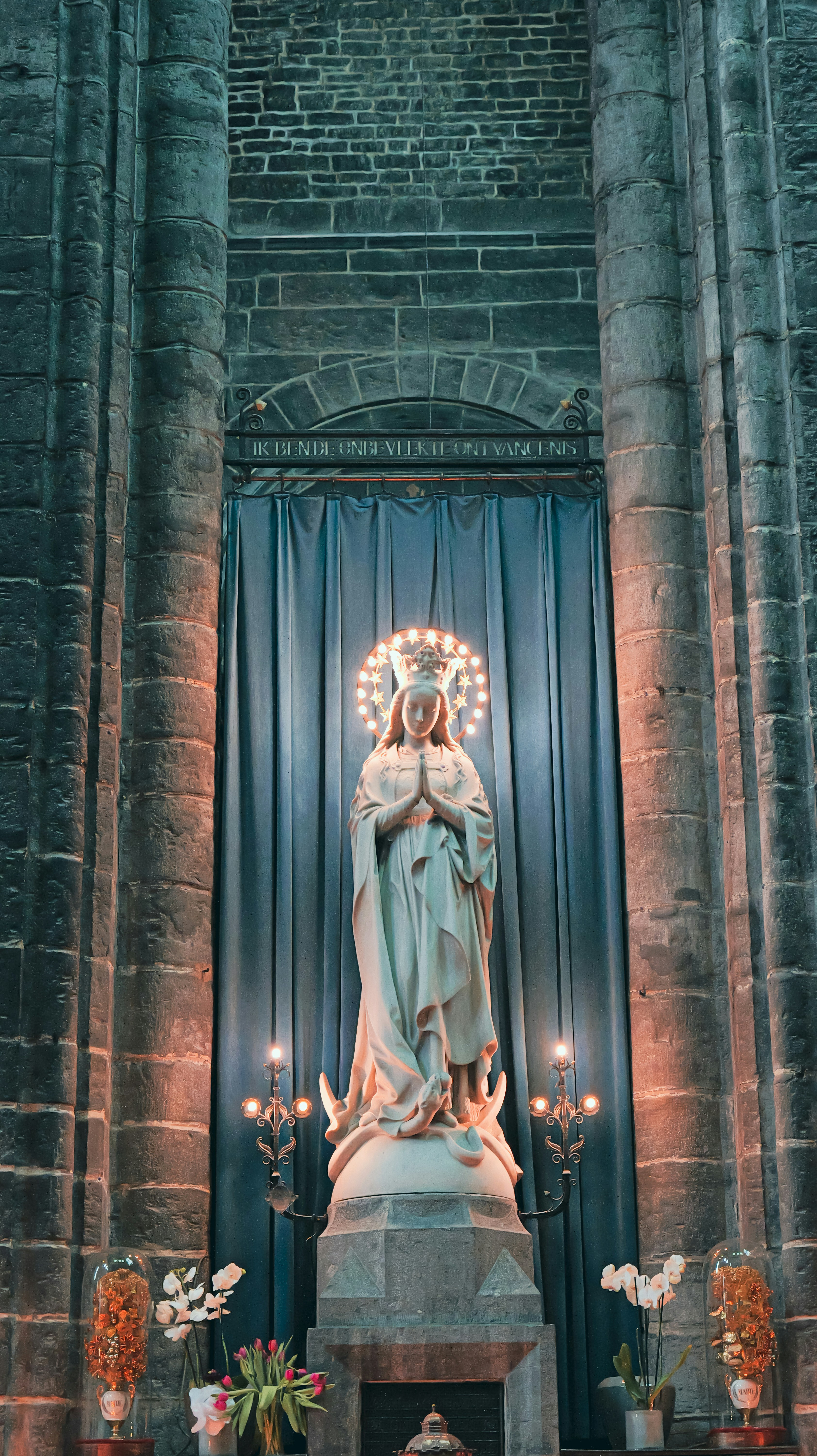 Statue of mary with halo in a grand church interior. - statue-of-mary-with-halo-in-a-grand-church-interior-Tg6f3g-iGtI