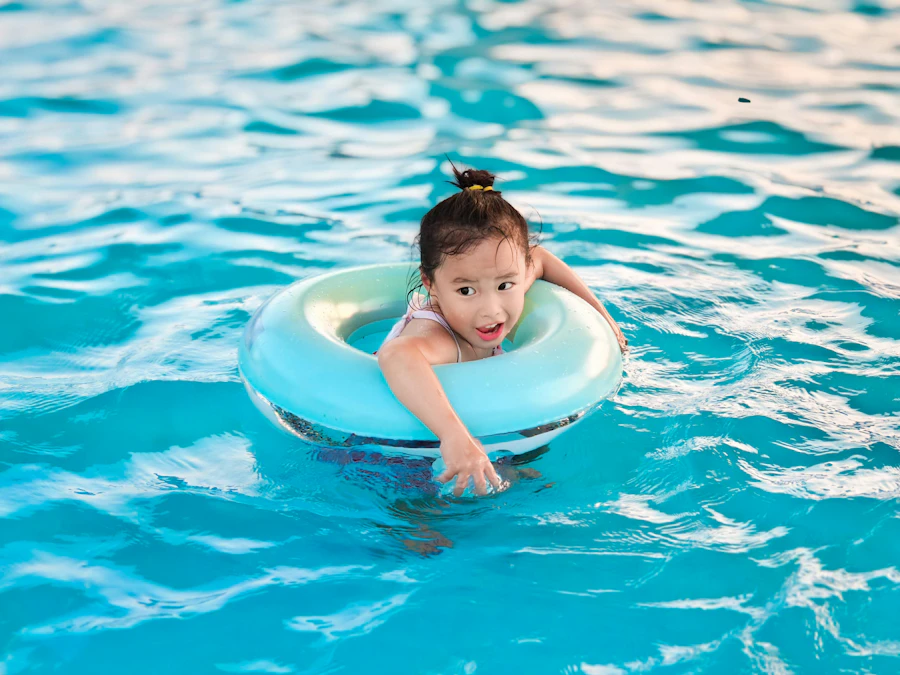 A young guest floating on an inflatable ring in the kiddie pool