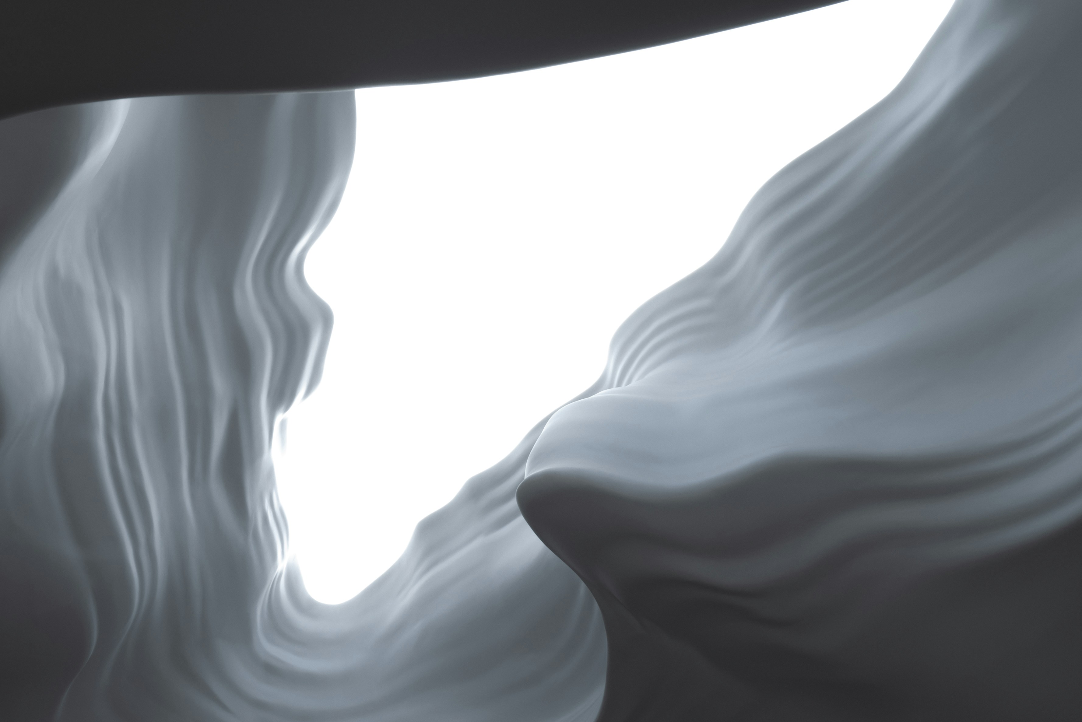 Formas grises abstractas y arremolinadas sobre un fondo blanco brillante