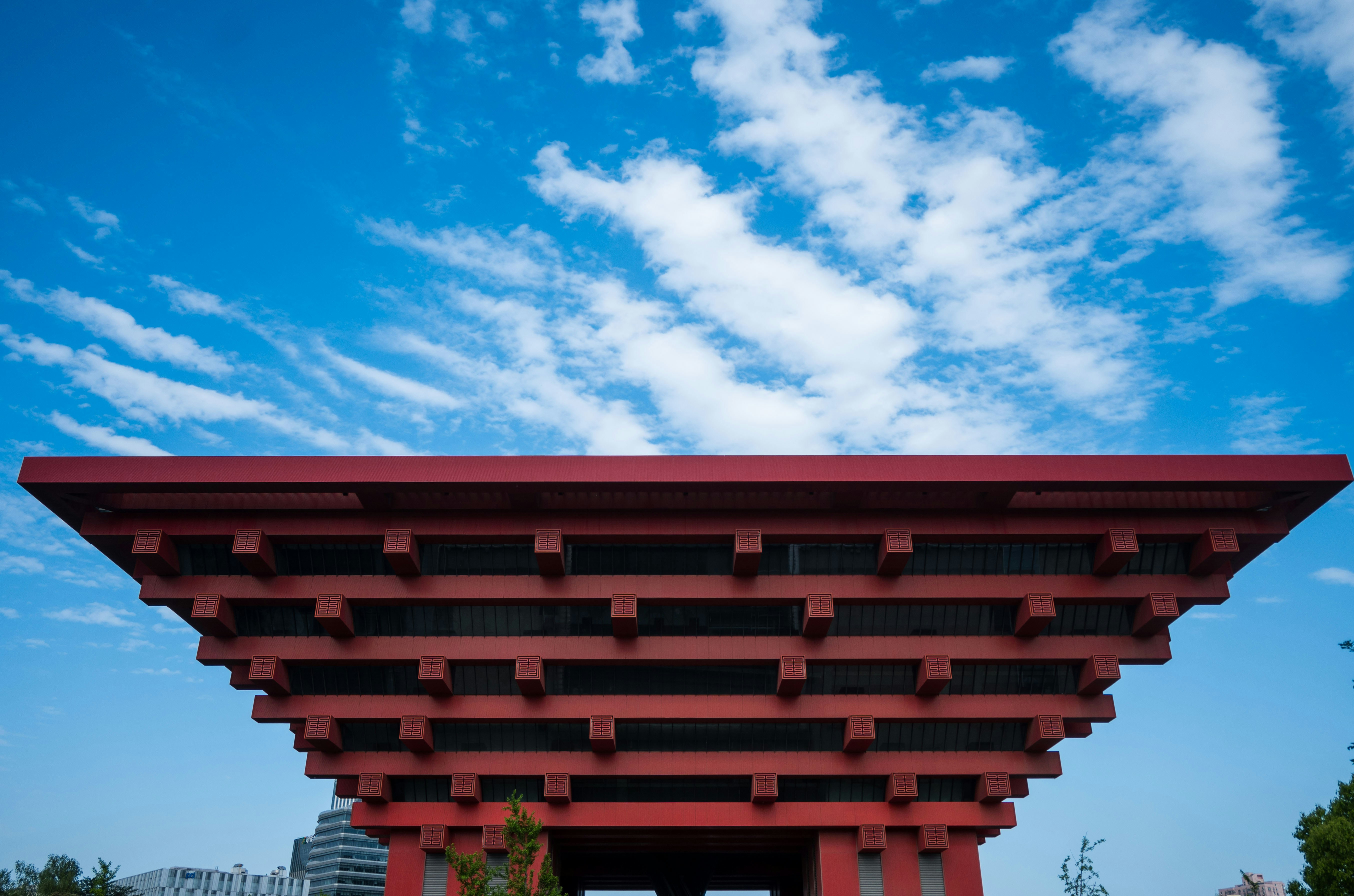 Red pagoda-like structure against a blue sky.