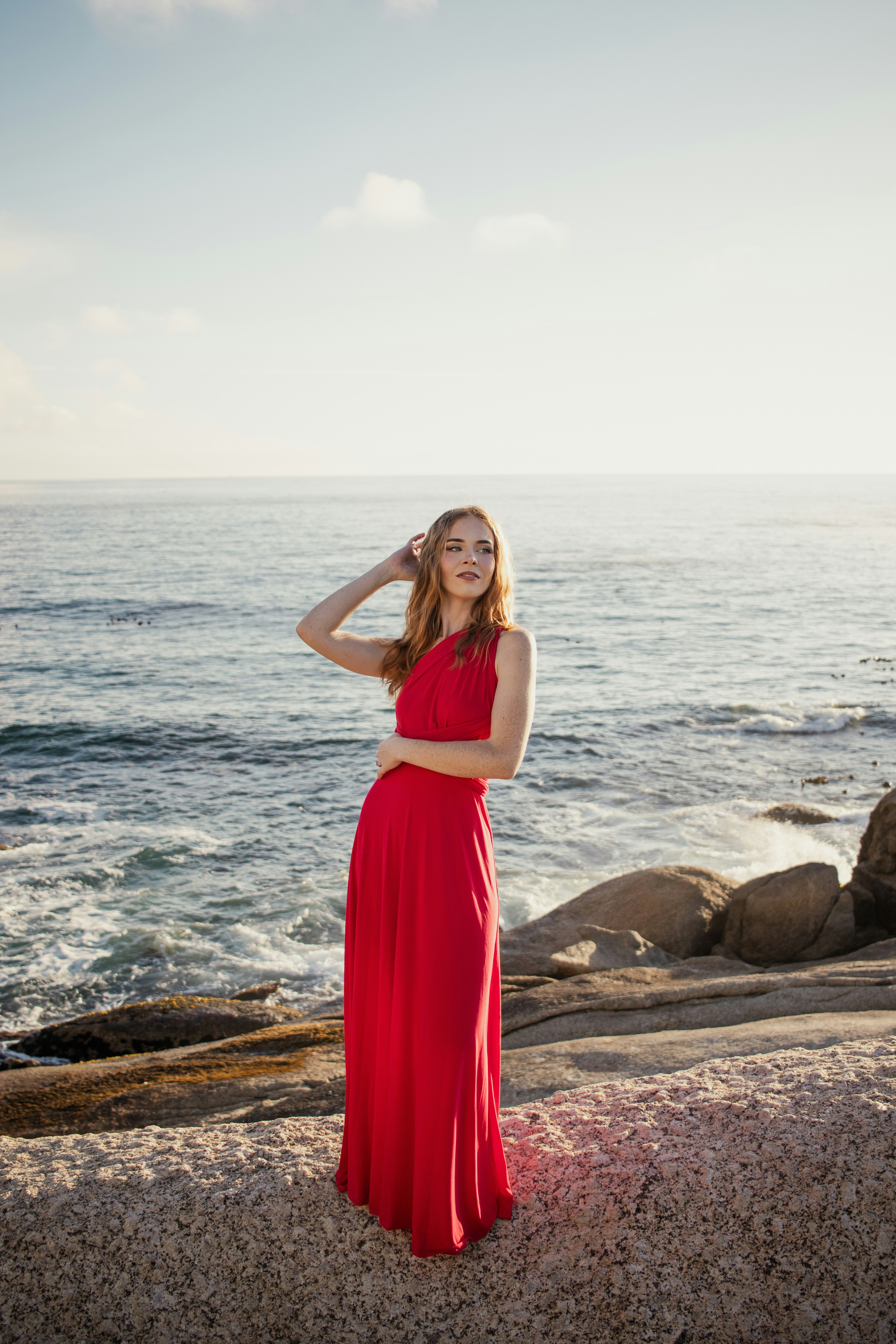 Young woman in red dress by the sea photo  Free Beach Image on Unsplash