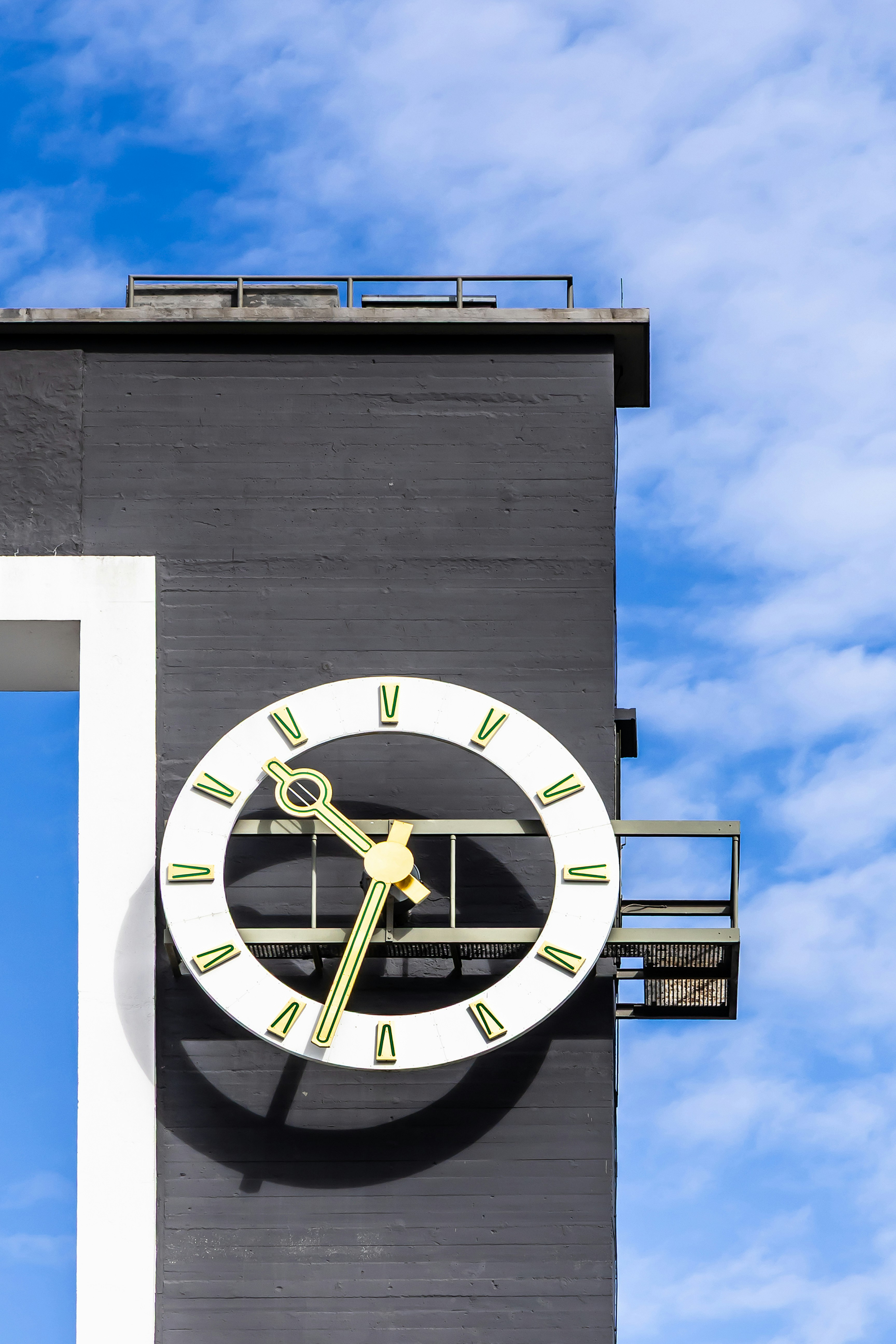 A large clock face on a dark building