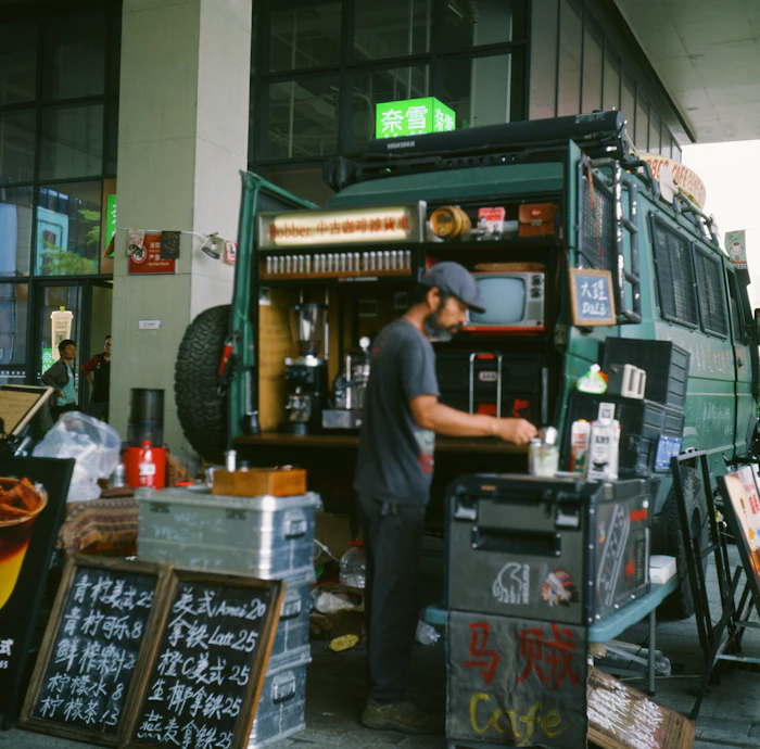 Barista preparing drinks at a mobile coffee van