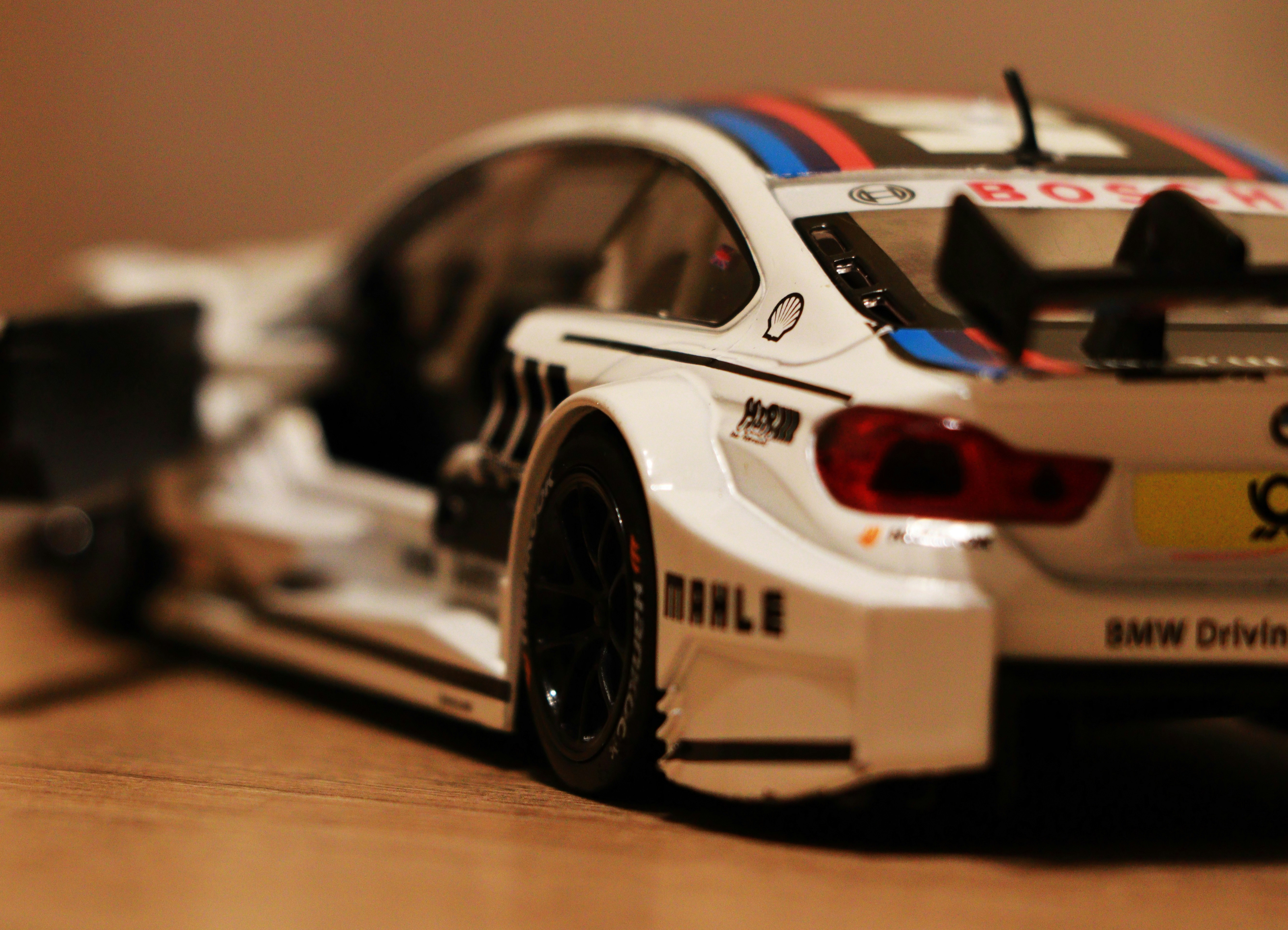 White race car with blue and red stripes