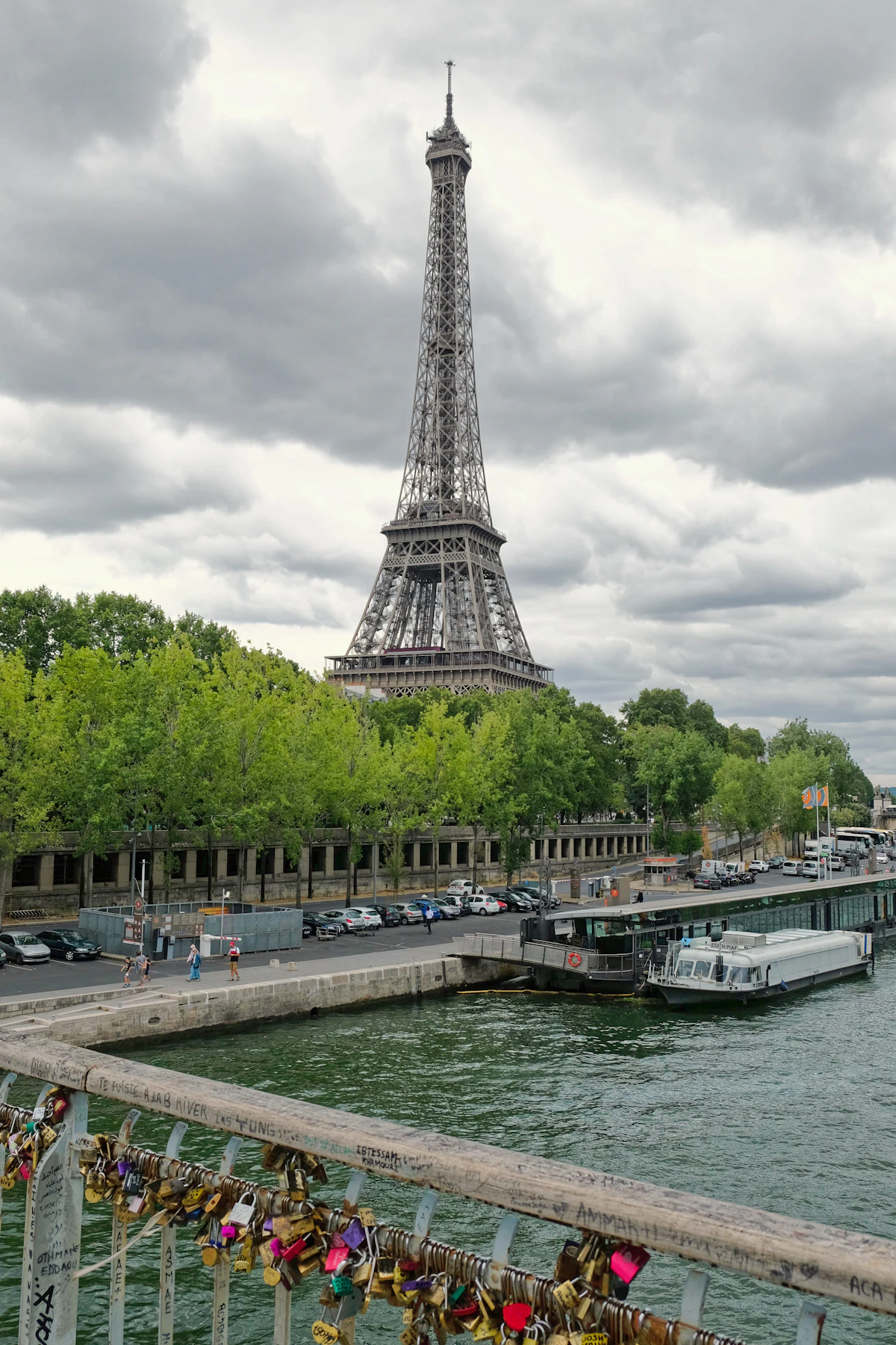 The Eiffel Tower rising above the River Seine and a Paris bridge