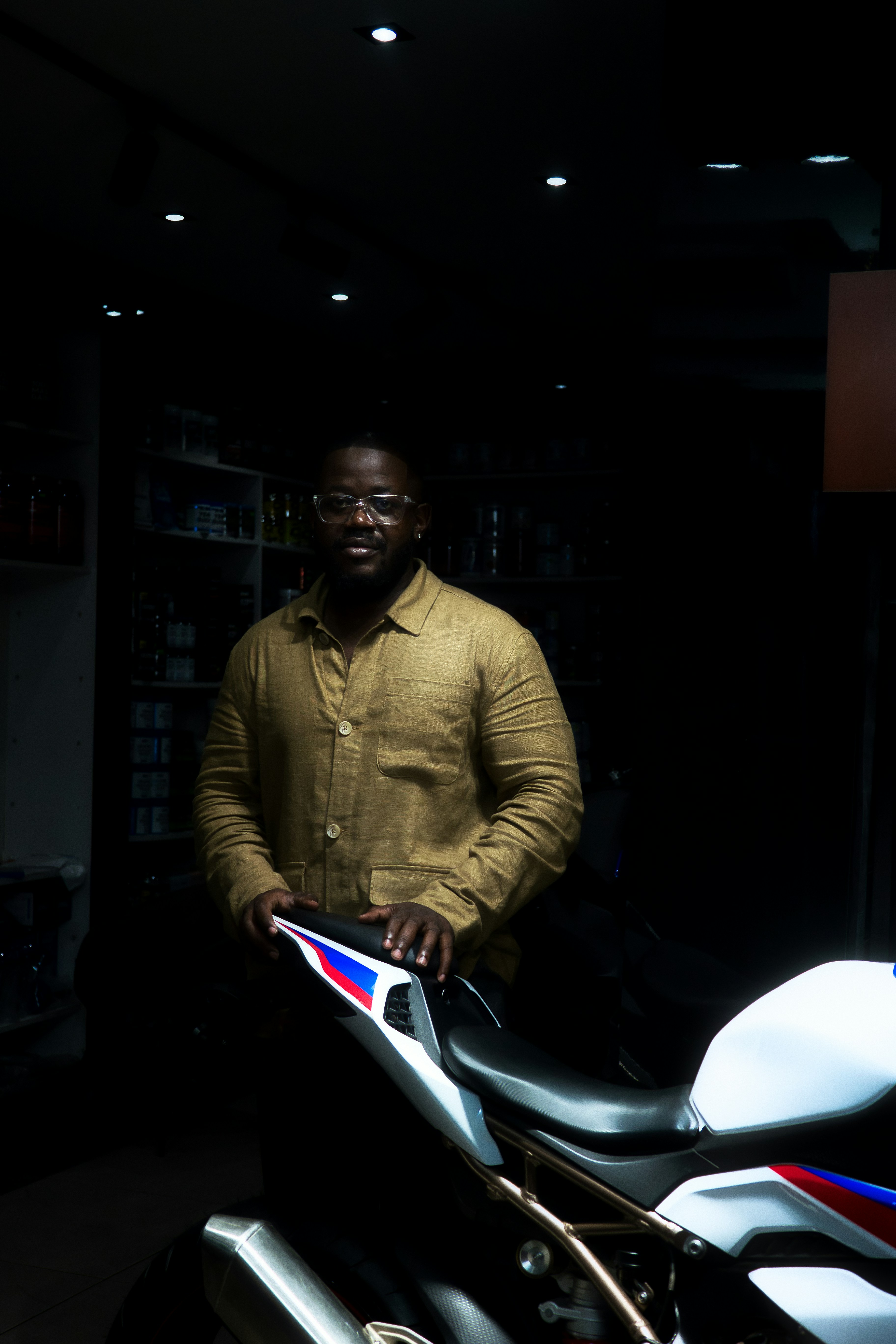 Man standing next to a modern motorcycle