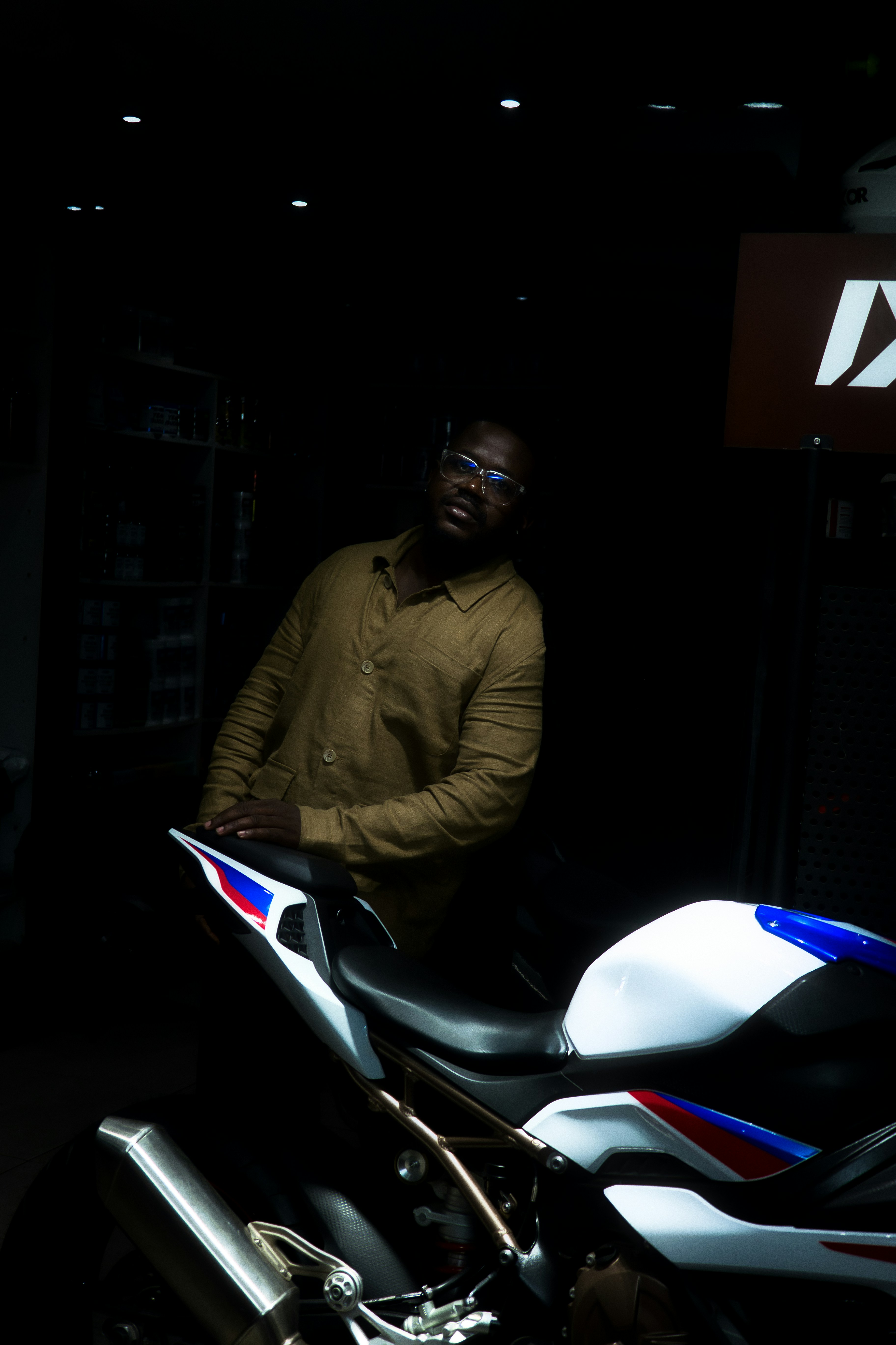 Man standing next to a sports motorcycle
