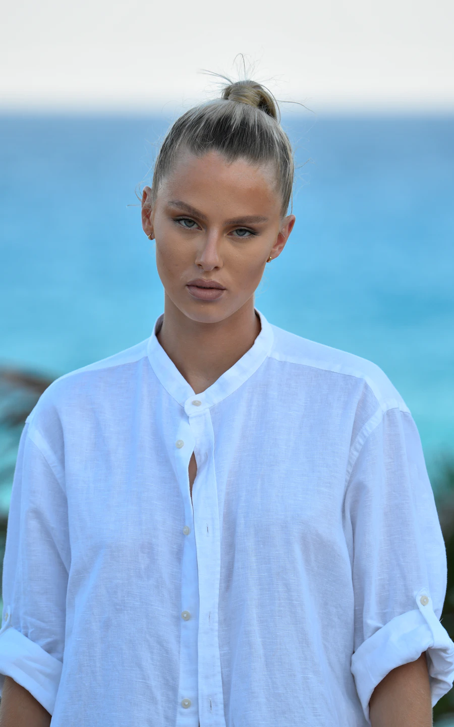Woman with smooth, firm skin by the ocean