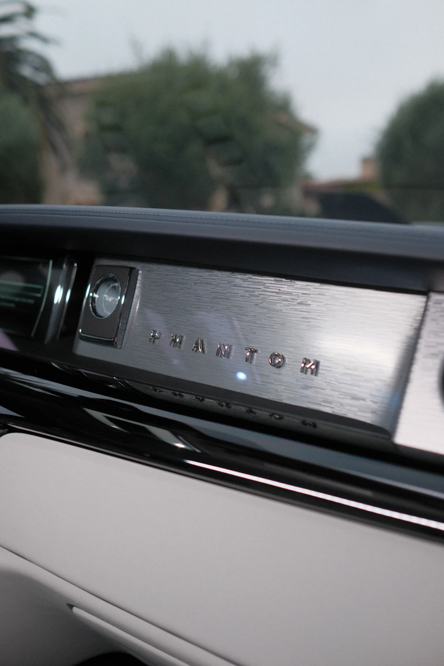 Luxury car dashboard emblem detail