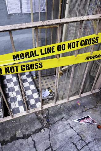 Yellow caution tape with "do not cross" text.