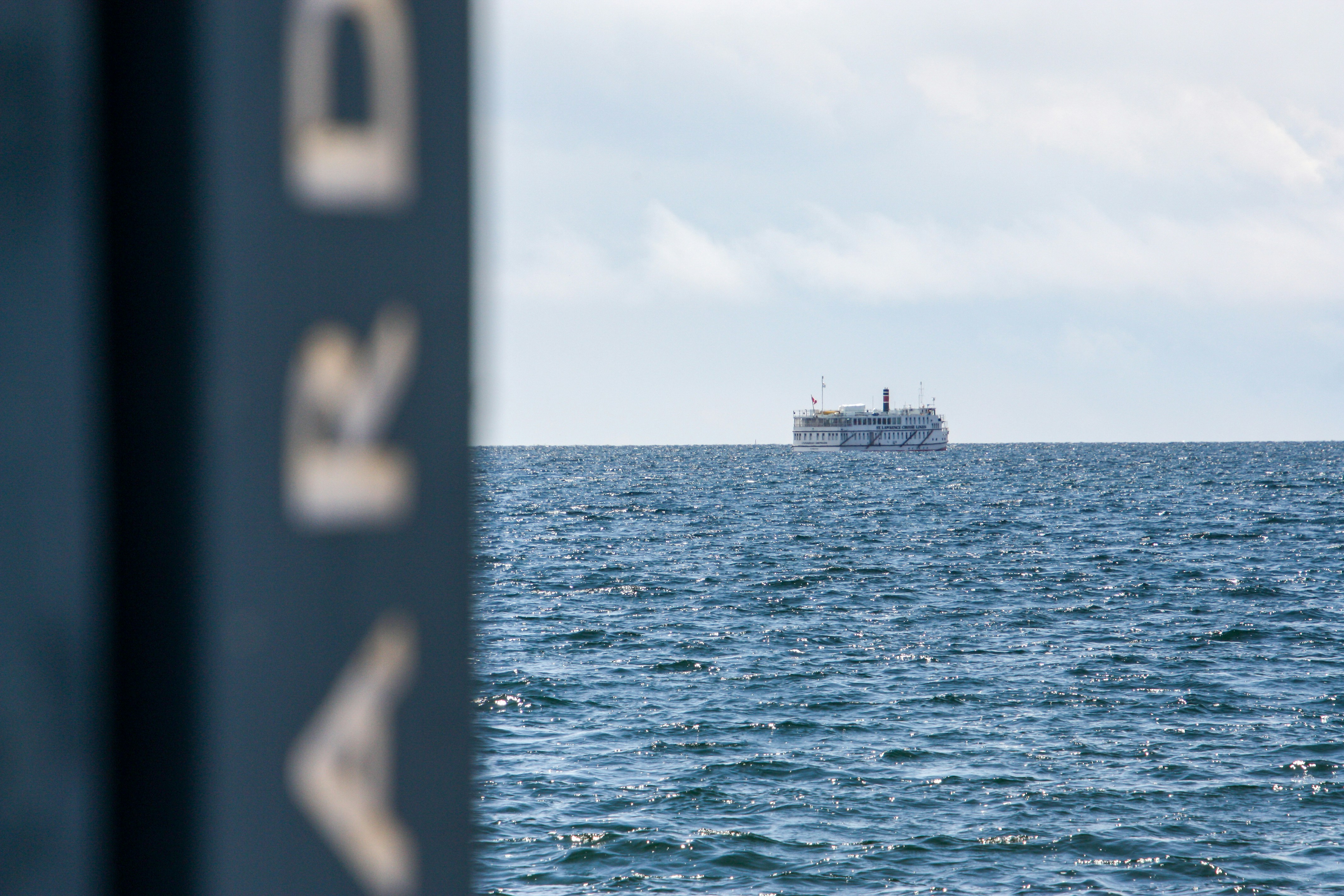 A large ferry boat sails on the ocean.