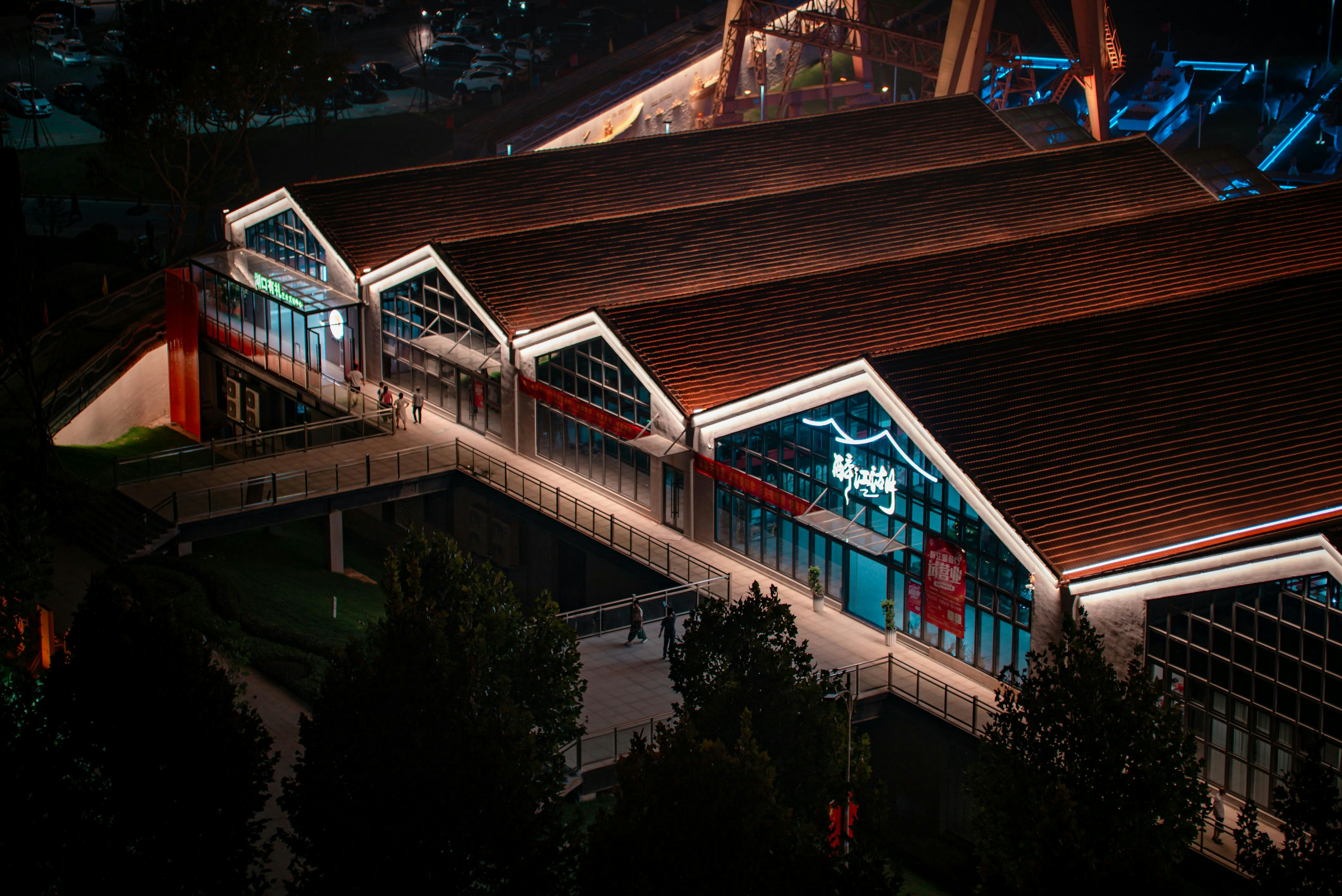 Modern building with illuminated roof at night