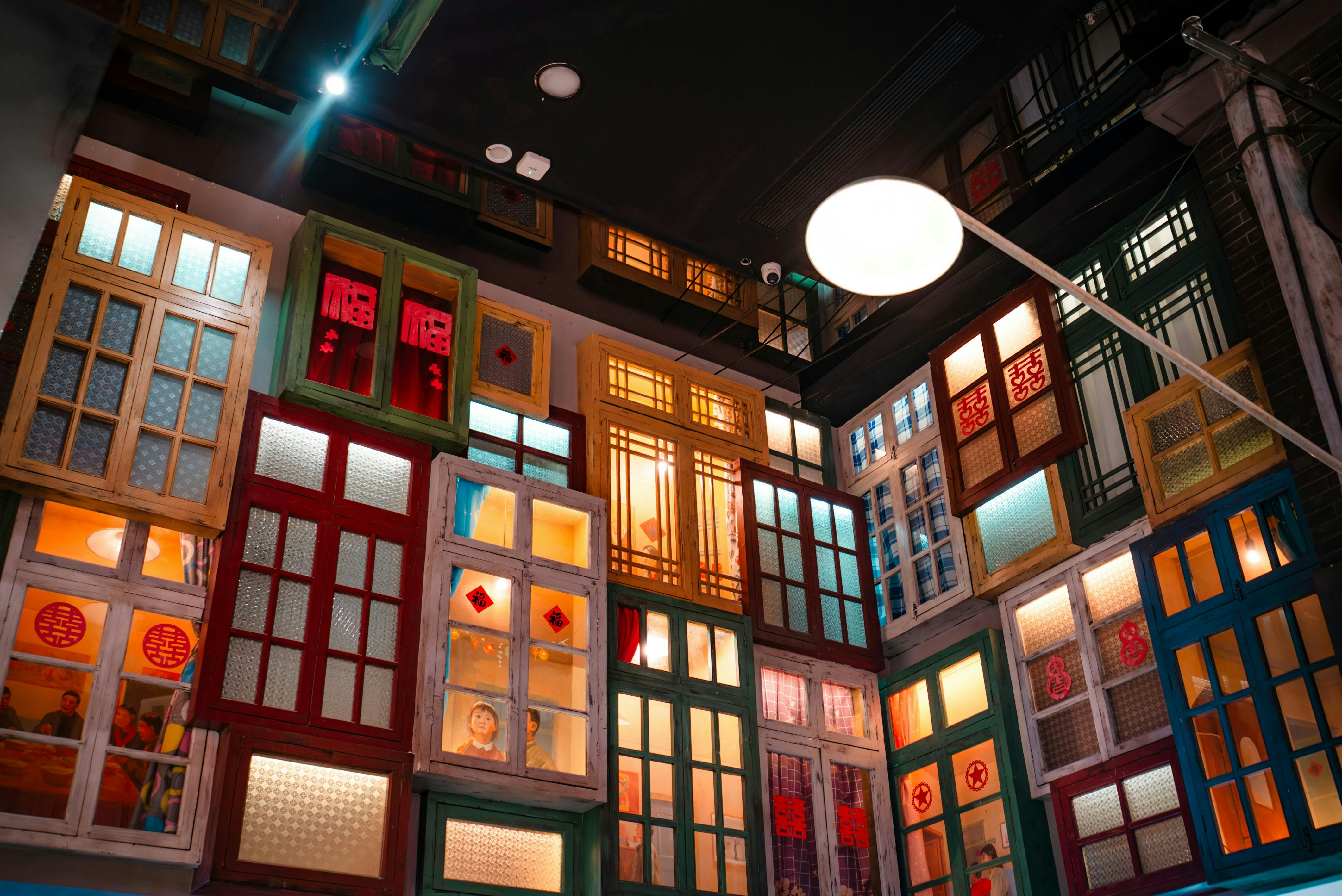 Colorful windows illuminated at night with decorative elements