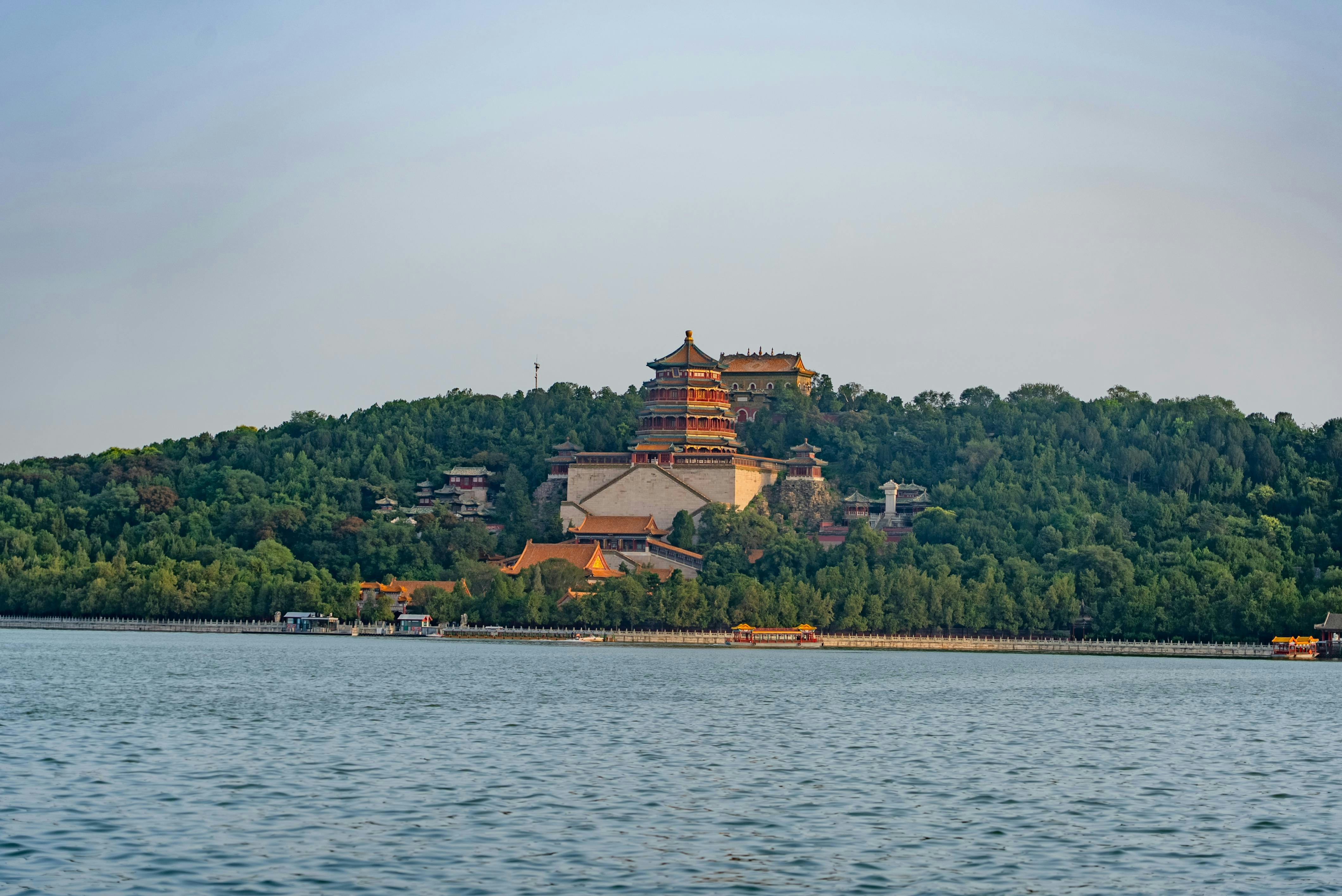 Palace on a hill overlooking a calm lake