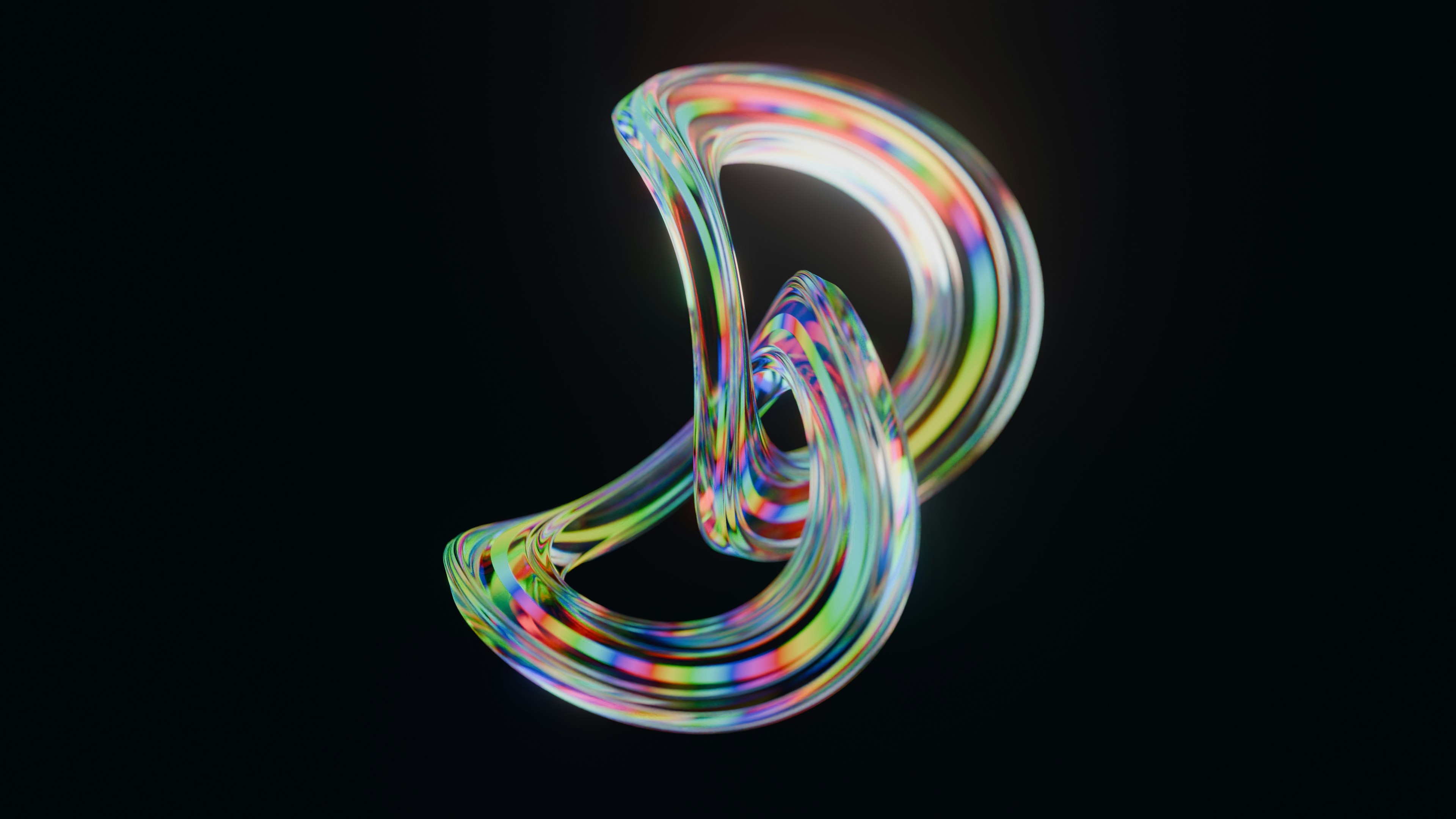 Abstract colorful glass sculpture on black background