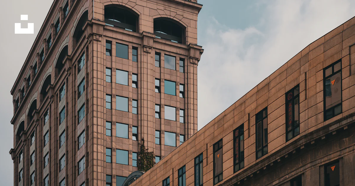 Tan Building Texture Two tan buildings against a cloudy sky. photo – Free Building Image on ...