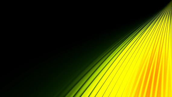 Bright yellow and orange light rays on black background