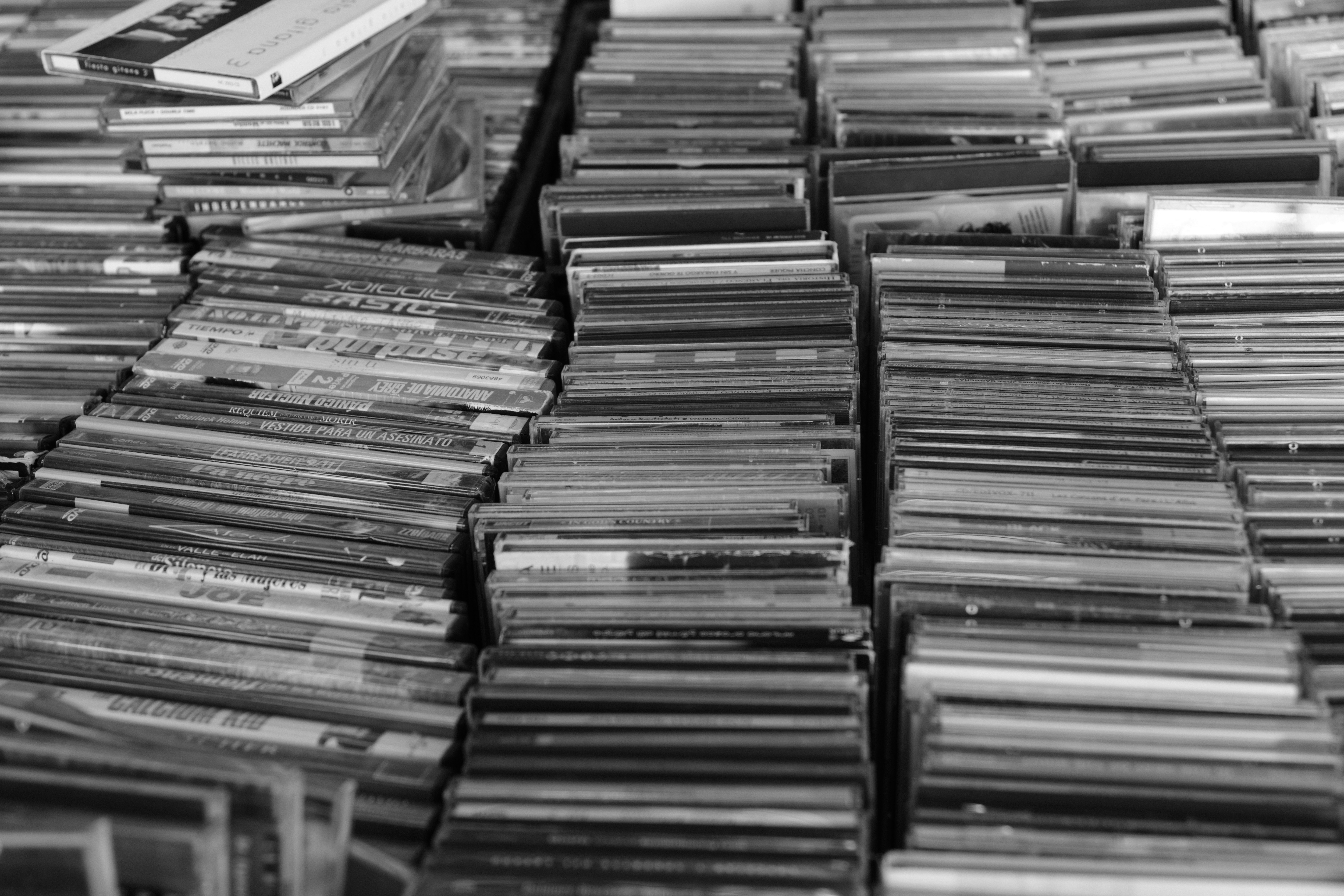 Stacks of books and cds in black and white