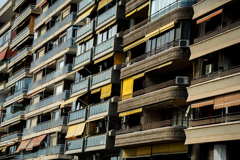 Sample property exterior, apartment building with balconies, no people