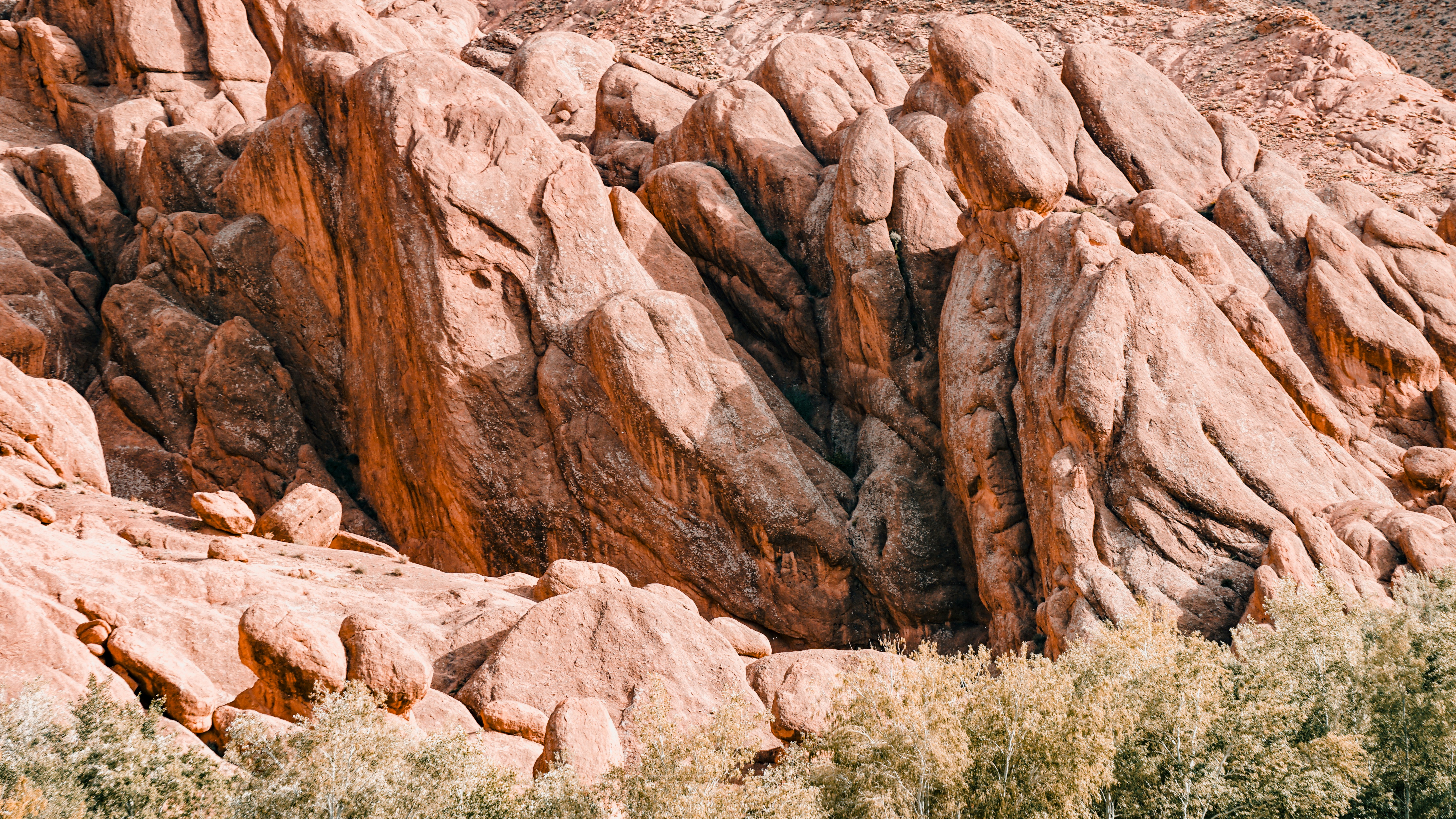Jagged red rock formations under a clear sky