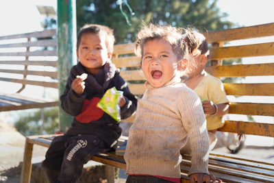A child balancing outdoors, mid-motion during active play