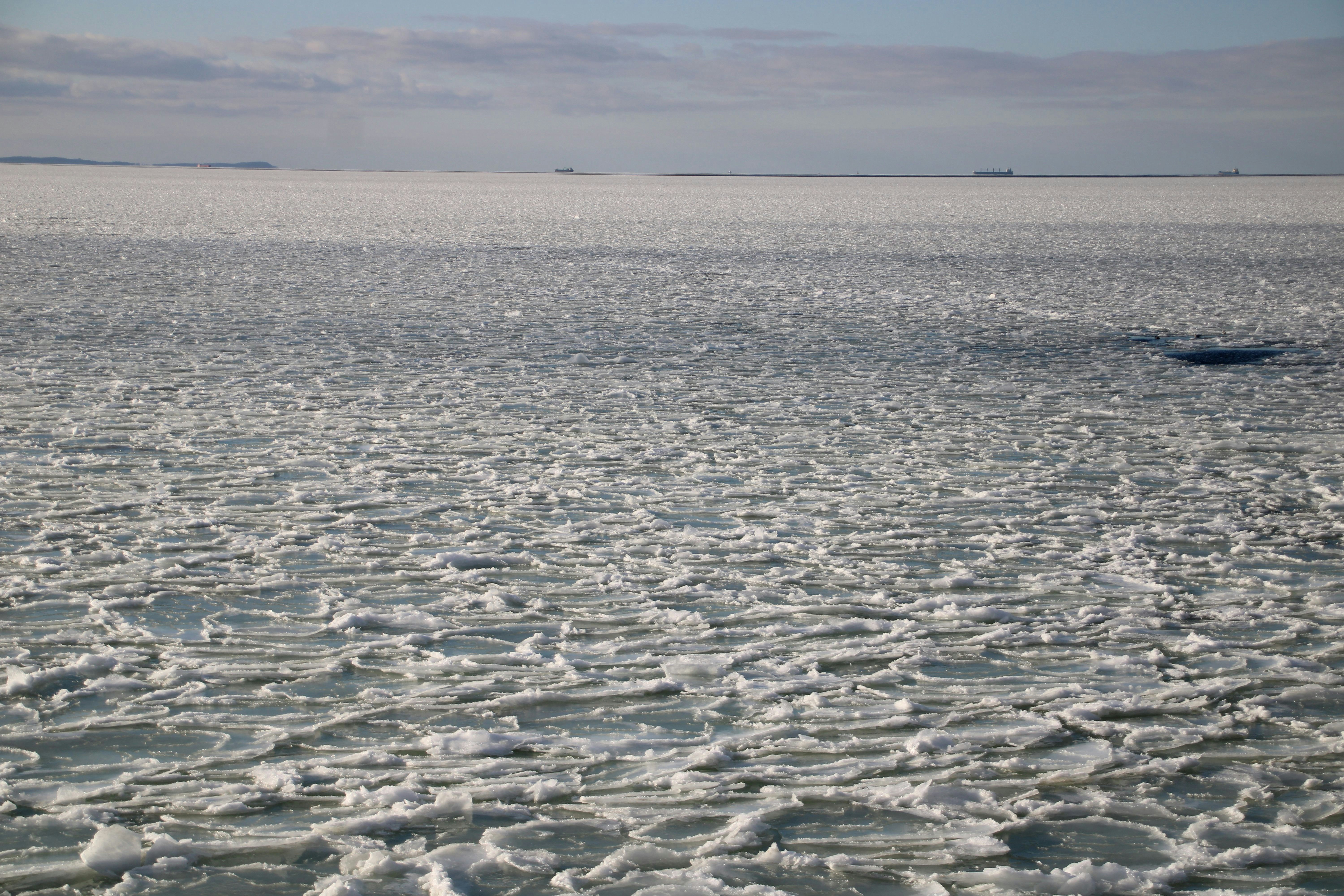 Vast expanse of broken ice under a cloudy sky