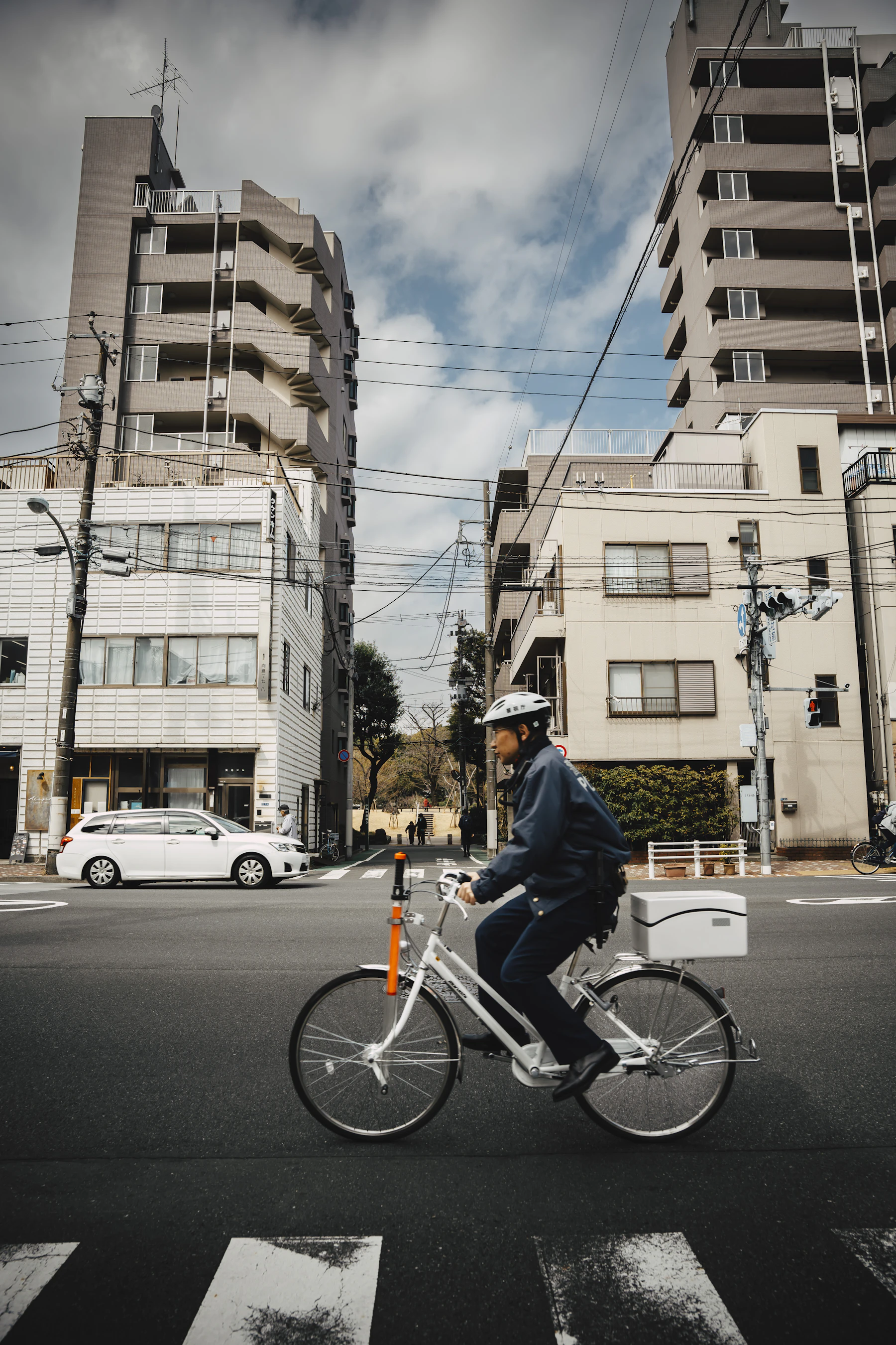 Cyclist riding through a city street during an everyday commute