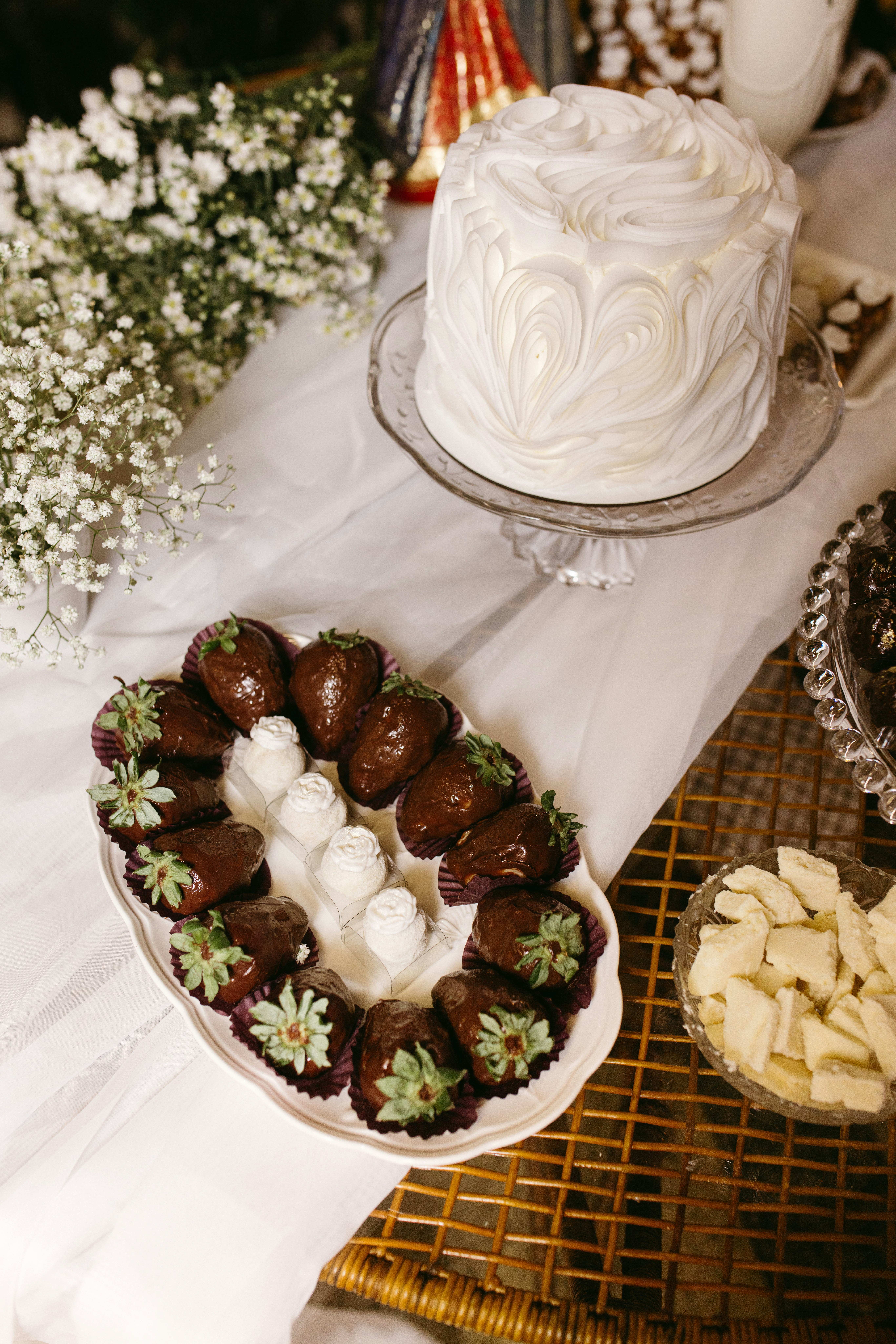 Chocolate-covered strawberries and a white cake