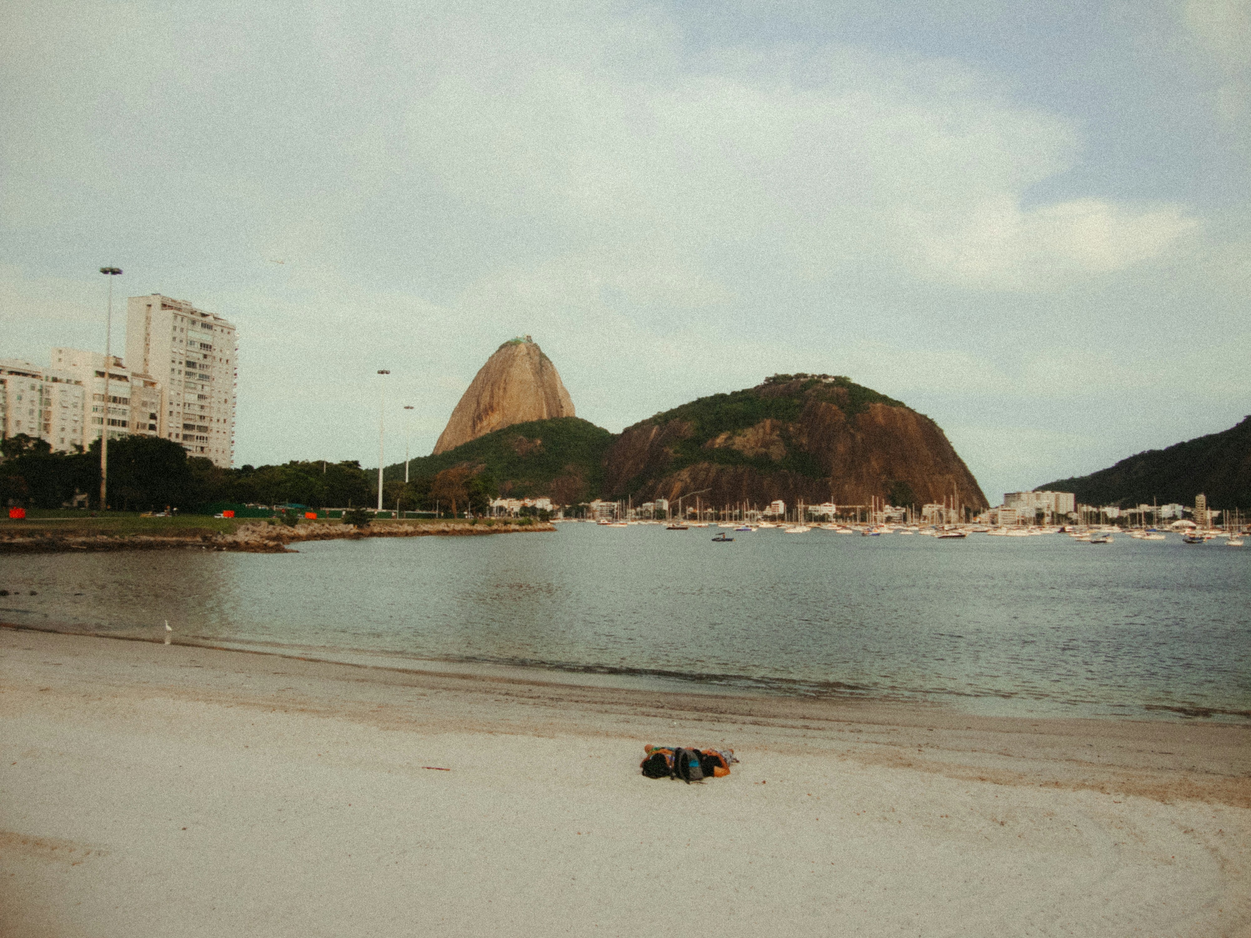 Beach and bay with sugarloaf mountain in background