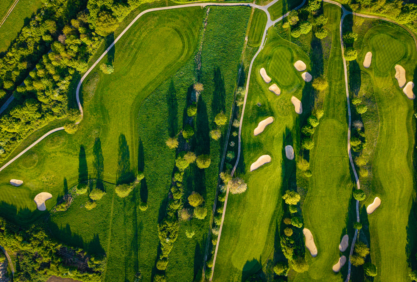 Aerial view of a golf course with winding fairways and bunkers