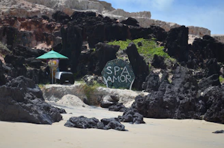 Sign for spa amor on a rocky beach