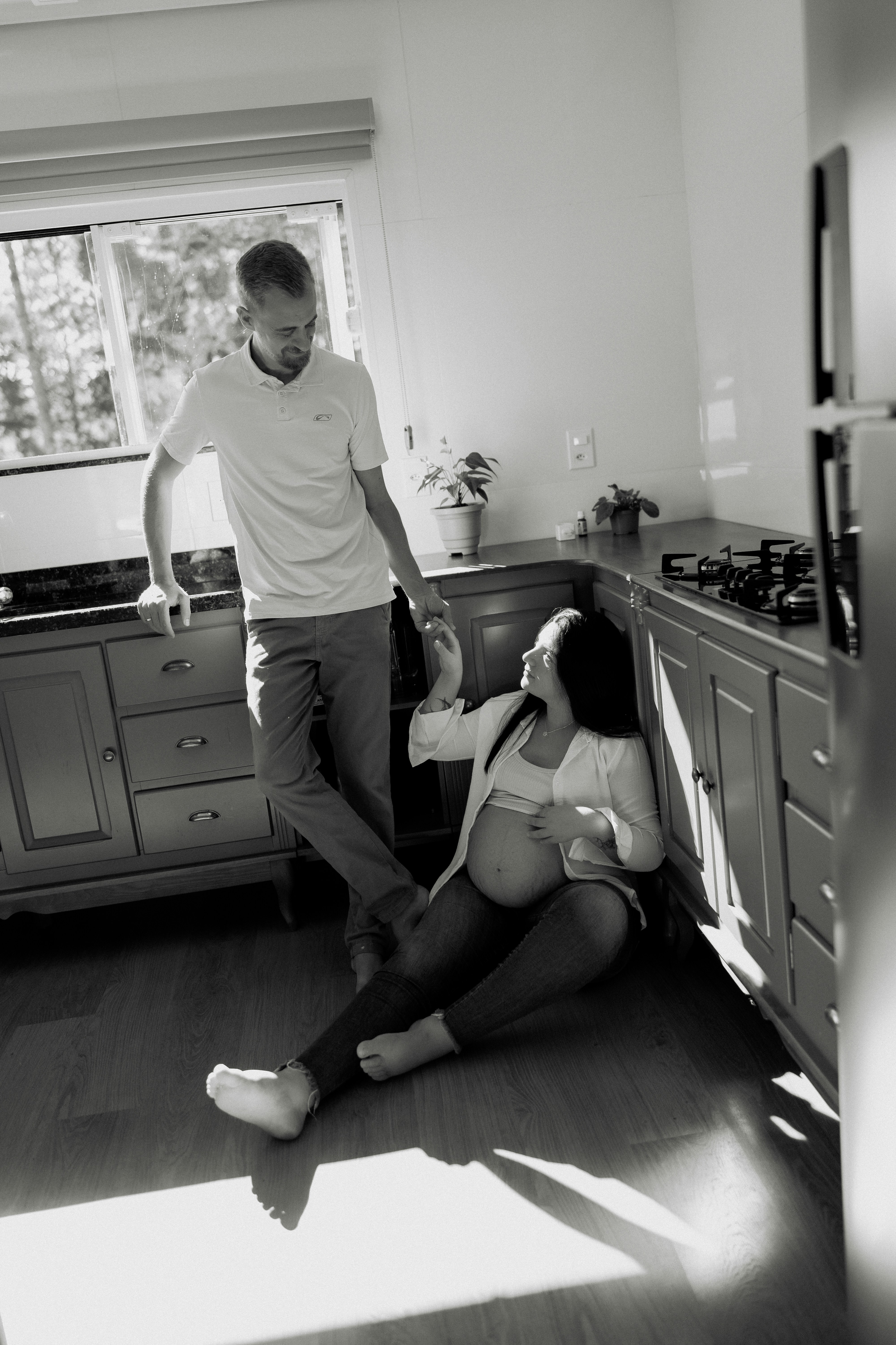 Casual portrait of Dan in his kitchen, soft window light.