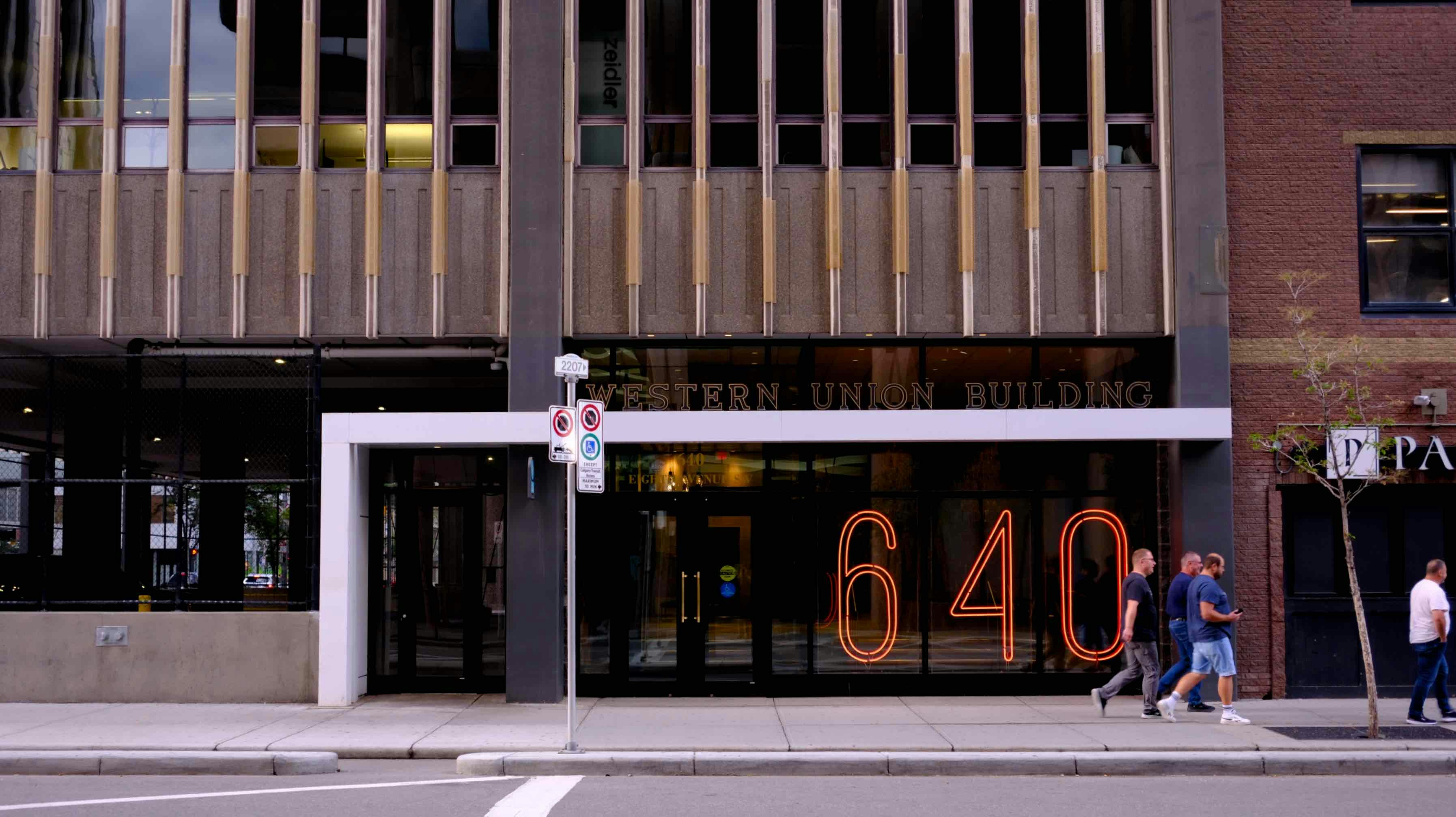 Modern building entrance with large number 640 displayed.