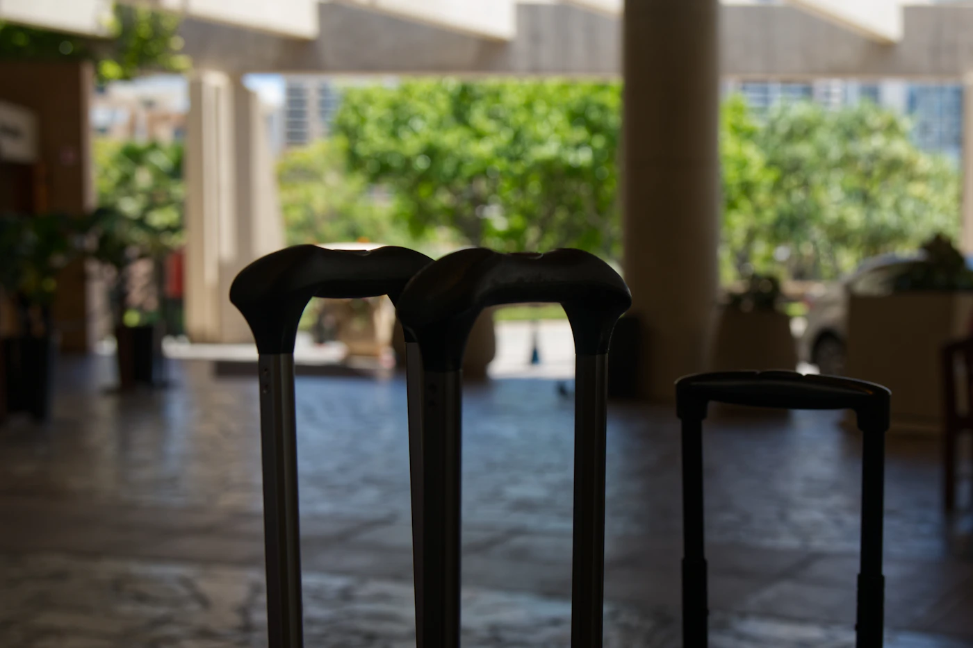 Real travel luggage waiting in an elegant hotel lobby